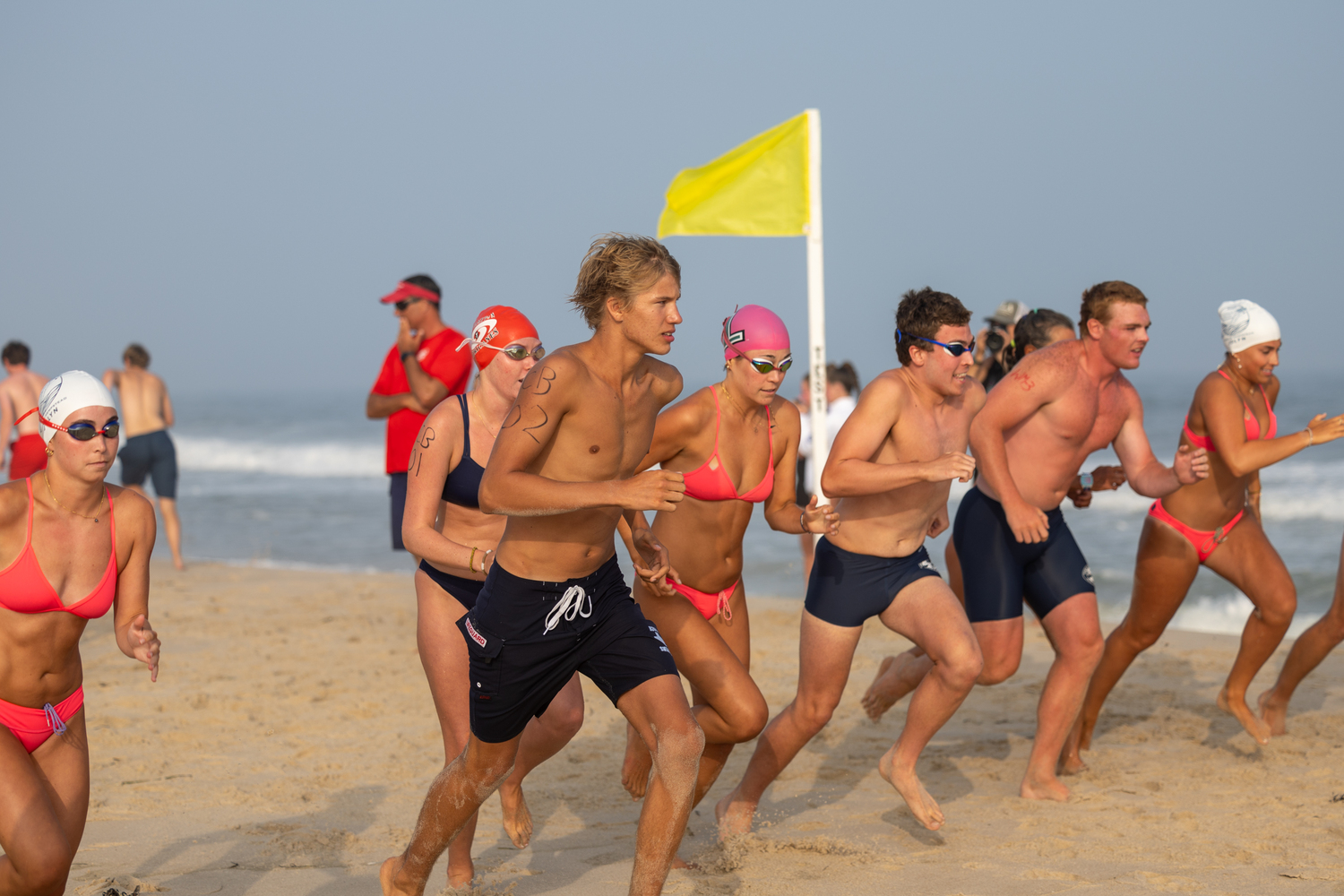 Lifeguards start the distance run.   RON ESPOSITO