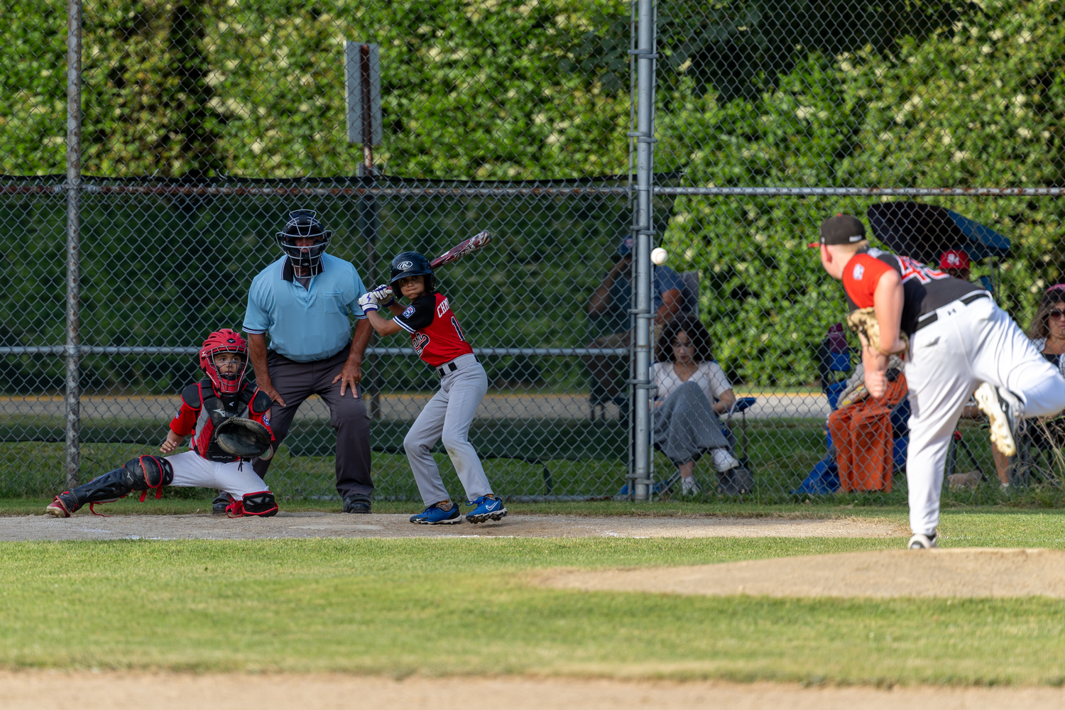 Chase Chmielewski gets ready for an incoming pitch during a July 3 game at the Bridgehampton Fire Department.   RON ESPOSITO