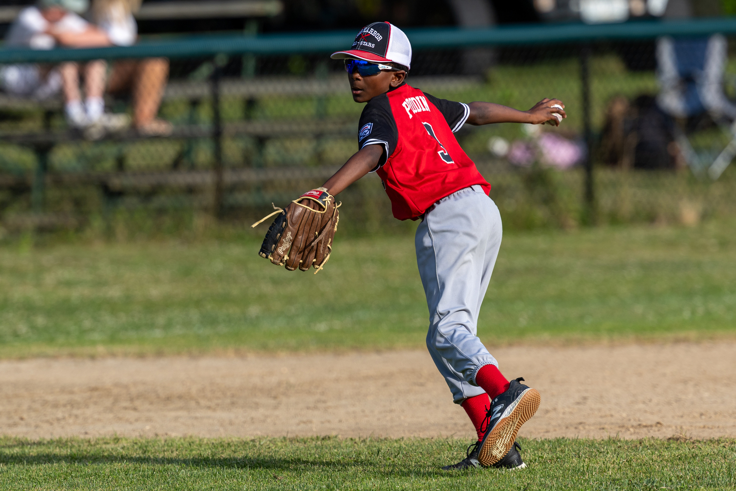 Michael Perodin looks to throw to first base after fielding a ground ball.  RON ESPOSITO