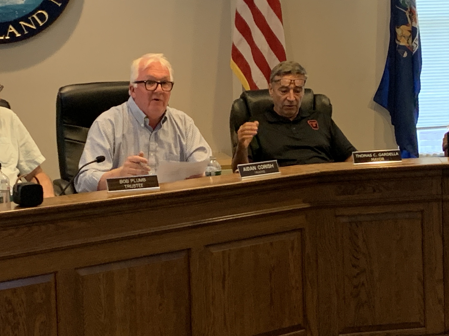 Trustee Aidan Corish, left, and Mayor Tom Gardella bickered and spoke over one another at Monday's meeting before reaching a compromise at the end of the day. STEPHEN J. KOTZ