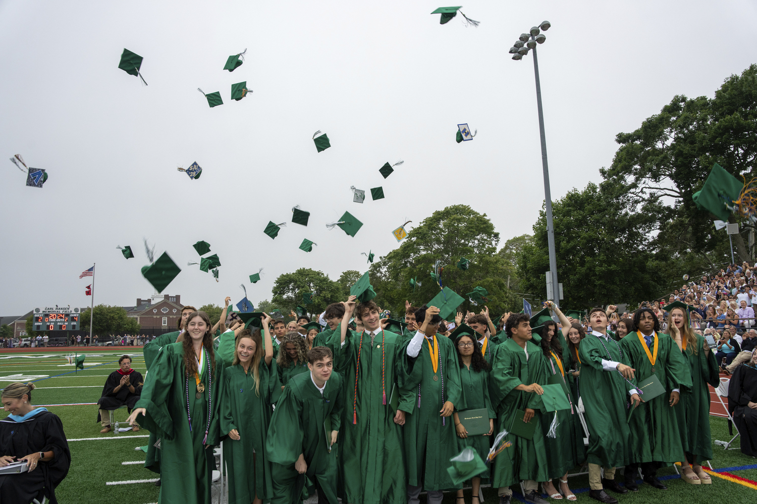 Graduates throw their caps Westhampton Beach High School commencement on June 26.    RON ESPOSITO
