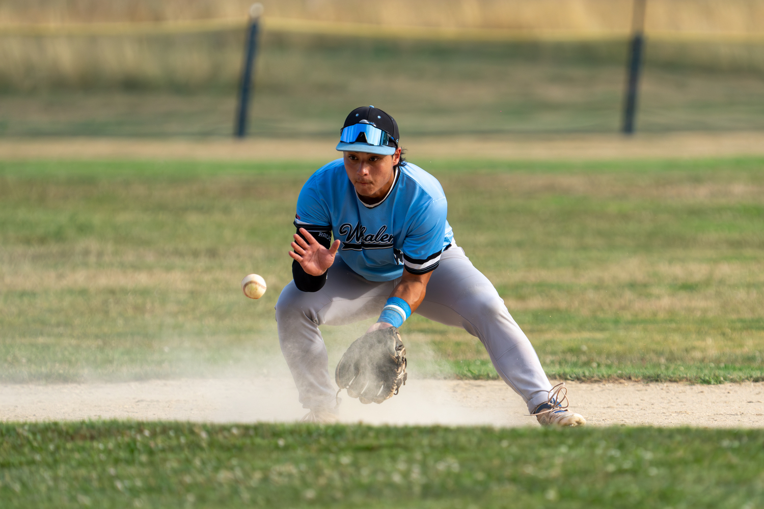 Jack Gold (Pomona-Pitzer) fields a ground ball.   RON ESPOSITO