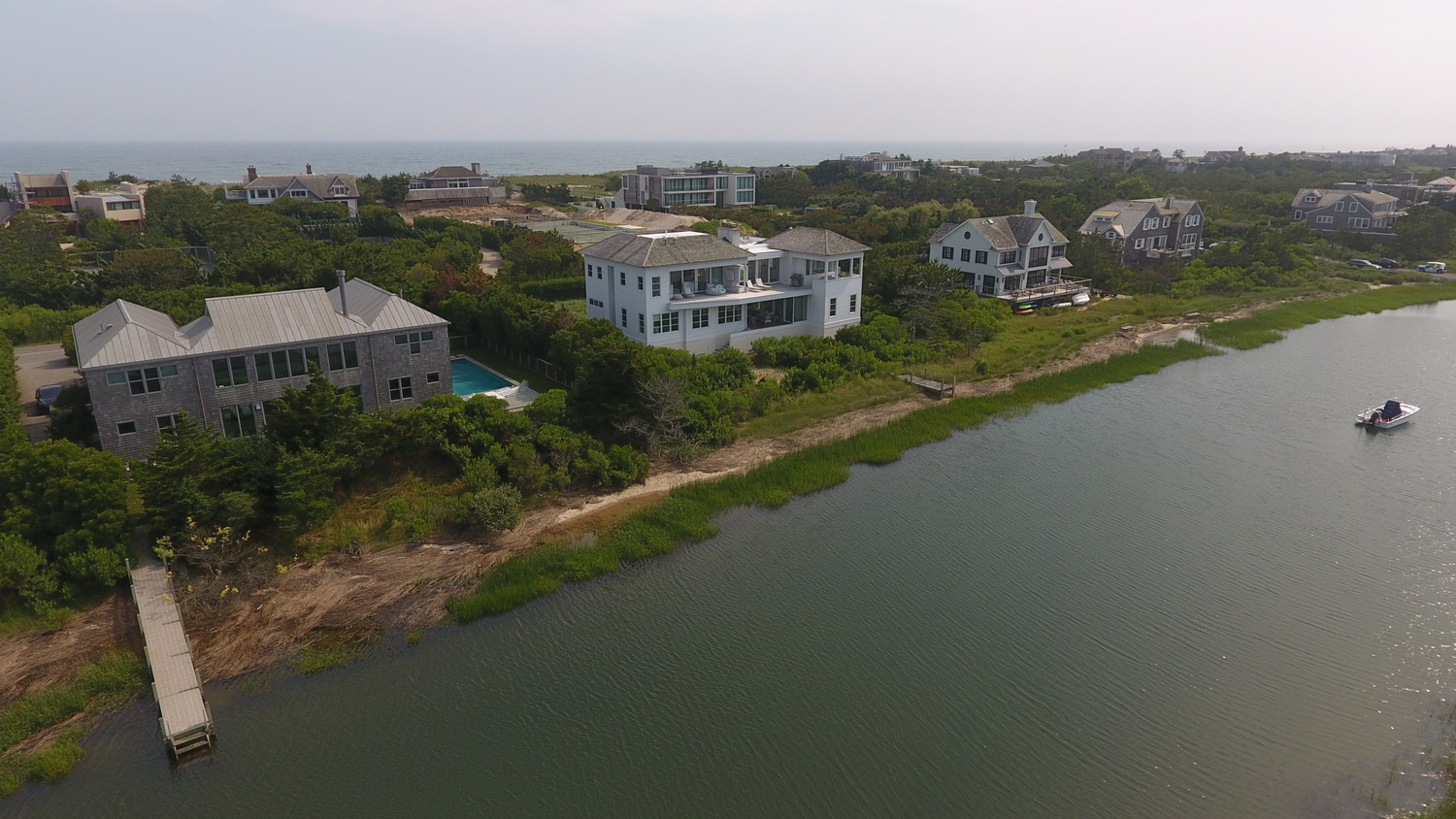 The white house in the center is 1377 Meadow Lane, where the Southampton Village Zoning Board of Appeals approved a dock contingent on a number of covenants. The owner is suing the ZBA, hoping the court will throw out the covenant requirements. He is pointing out that his next door neighbor, who was the ZBA chairman at the time, has a dock with no such covenants mandated.