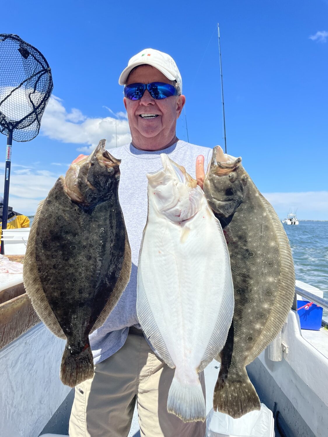 Tim Cary of Eastport with a nice limit of Shinnecock Bay fluke caught aboard the Shinnecock Star recently. DEENA LIPPMAN