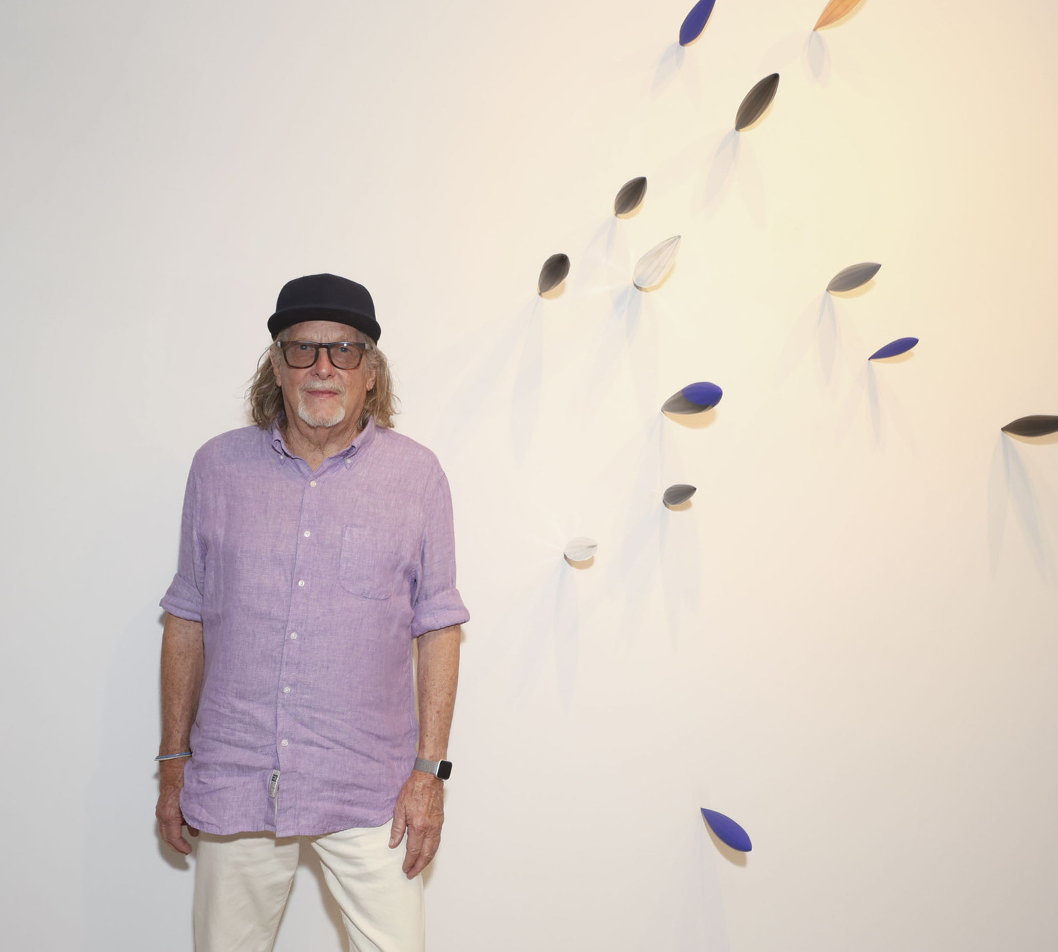 Artist Bryan Hunt with his work at the opening of 