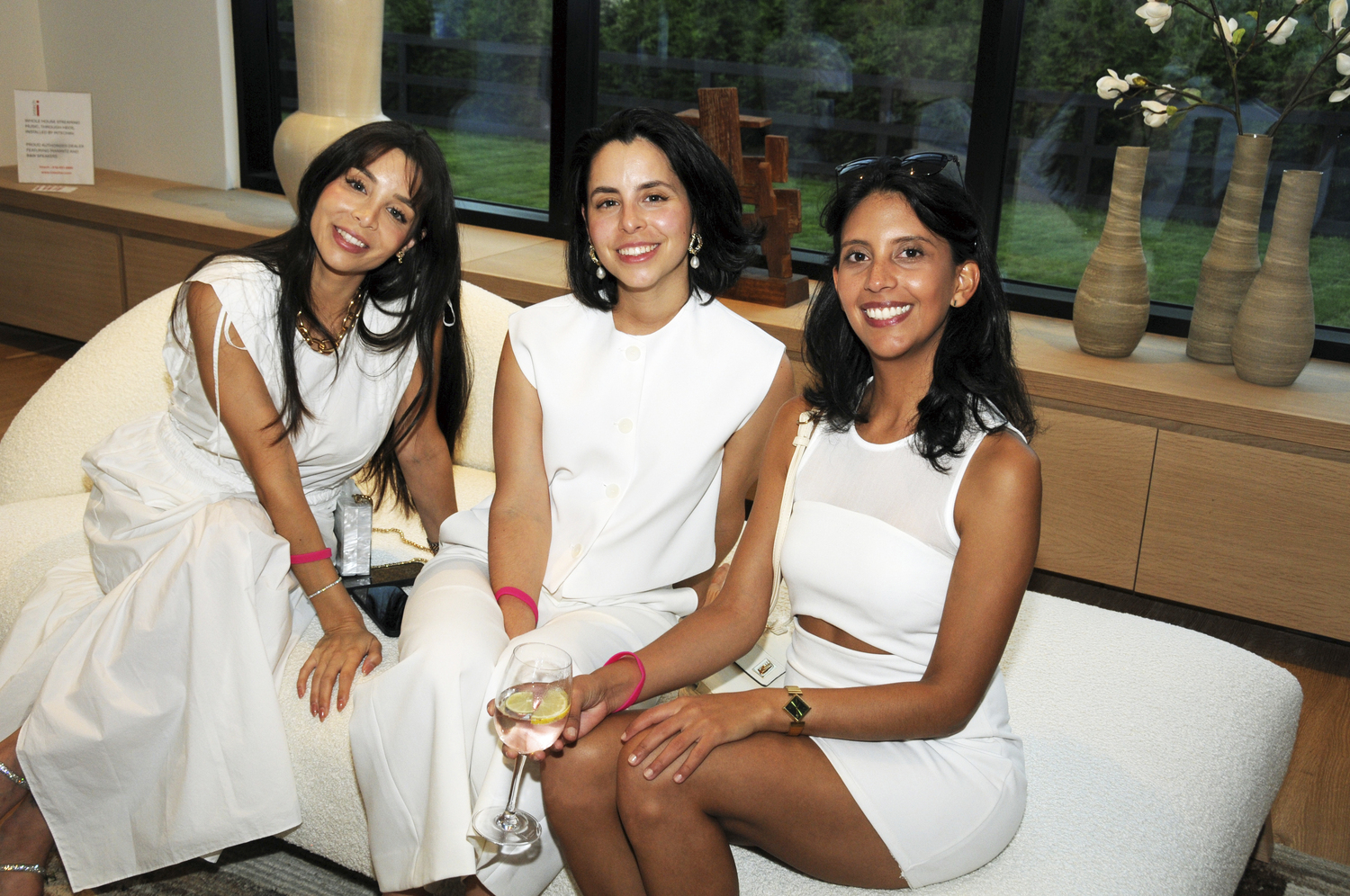 Melissa Garcia, Sofia Garcia and Fabiana Hernandez at the Holiday House Hamptons Designer Showhouse White Party on Saturday in  White Party in Bridgehampton.  RICHARD LEWIN