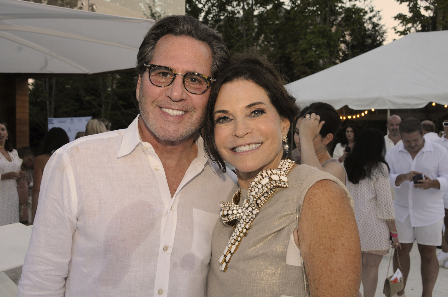 Dr. Howard Sobel and Iris Dankner at the Holiday House Hamptons Designer Showhouse White Party on Saturday in  White Party in Bridgehampton.  RICHARD LEWIN