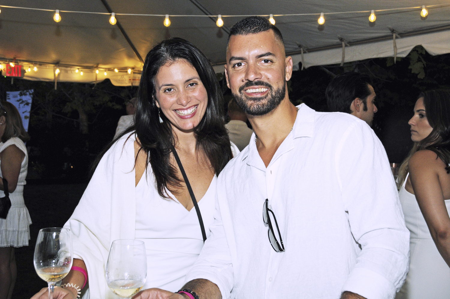 Diana Viera and Greg Martinez at the Holiday House Hamptons Designer Showhouse White Party on Saturday in  White Party in Bridgehampton.  RICHARD LEWIN