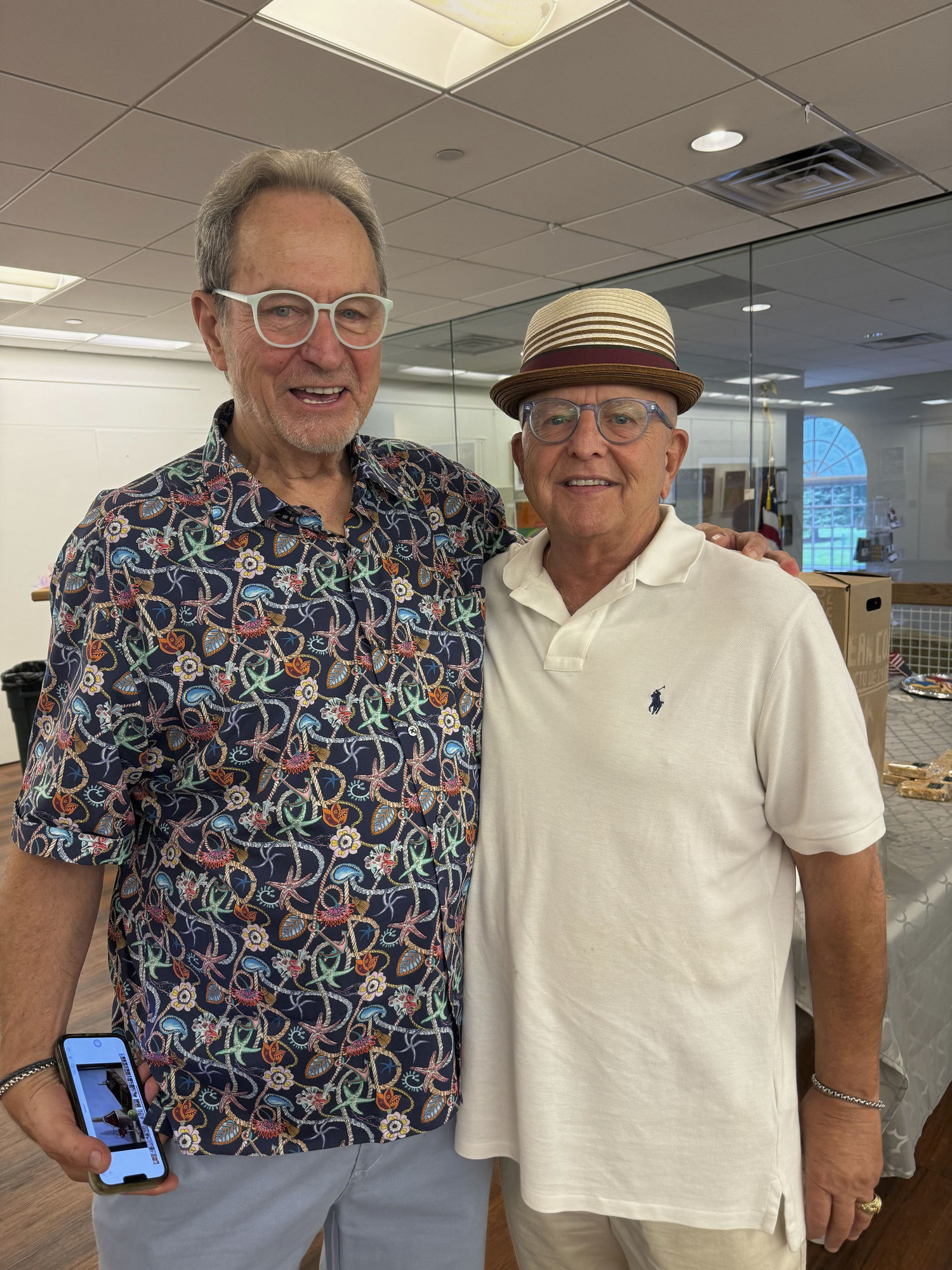 Vietnam Veteran and artist John Melillo with Bill Jones at Melillo's Life Goes on Part 4 art show at the Southampton Cultural Center on August 15.     COURTESY BETH MELILLO