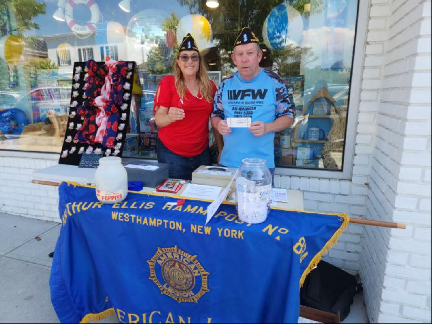 Lisha Terry and Tom Quinn sold tickets to the American Legion Post 834 fundraising breakfast on Main Street in Westhampton Beach the day before the August 11 event, which was a huge success. COURTESY TOM HADLOCK