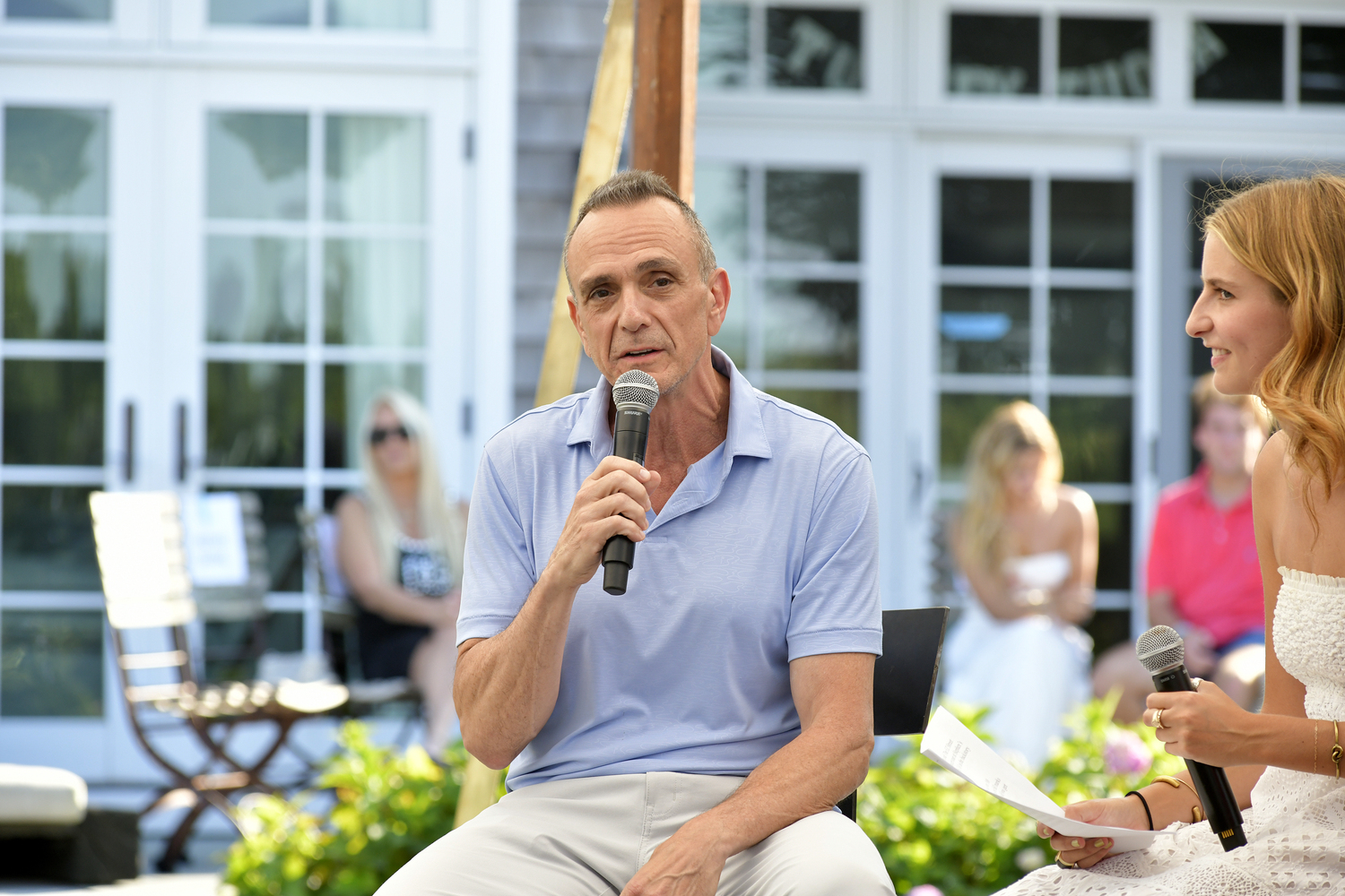 Actor Hank Azaria speaks at the Generation S.O.S. benefit in Water Mill on Sunday afternoon.  DANA SHAW