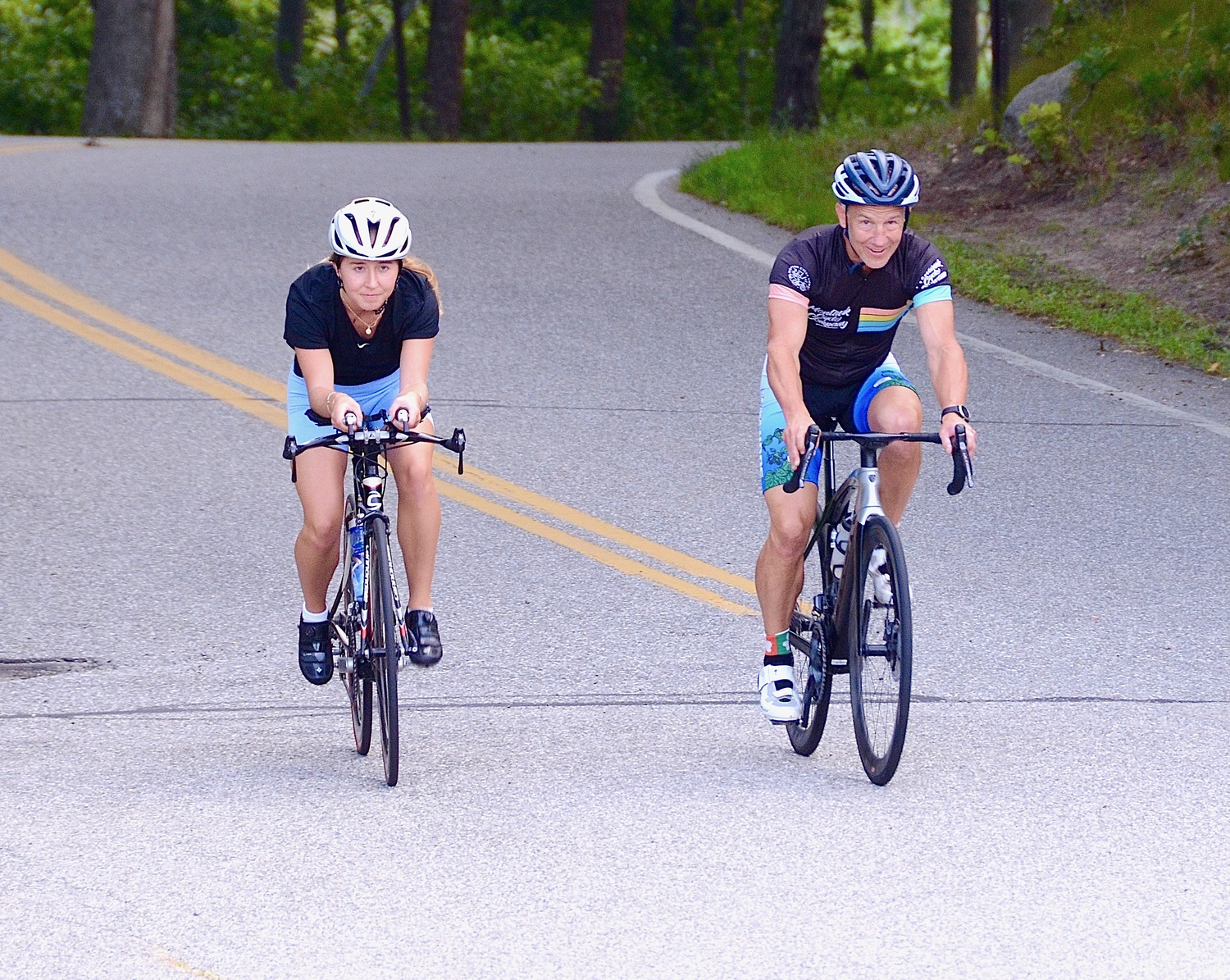 East Hampton resident Alyssa Bahel and her father, Mike, ride their bikes during triathlon training. KYRIL BROMLEY