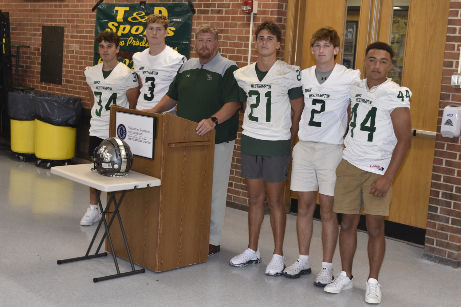 James Sarno, left, David Rankin, head coach Bryan Schaumloffel, Brody Schaffer, Finn Drake and Aidan Arrasate represented the Hurricanes at Friday's countywide media day.   DREW BUDD