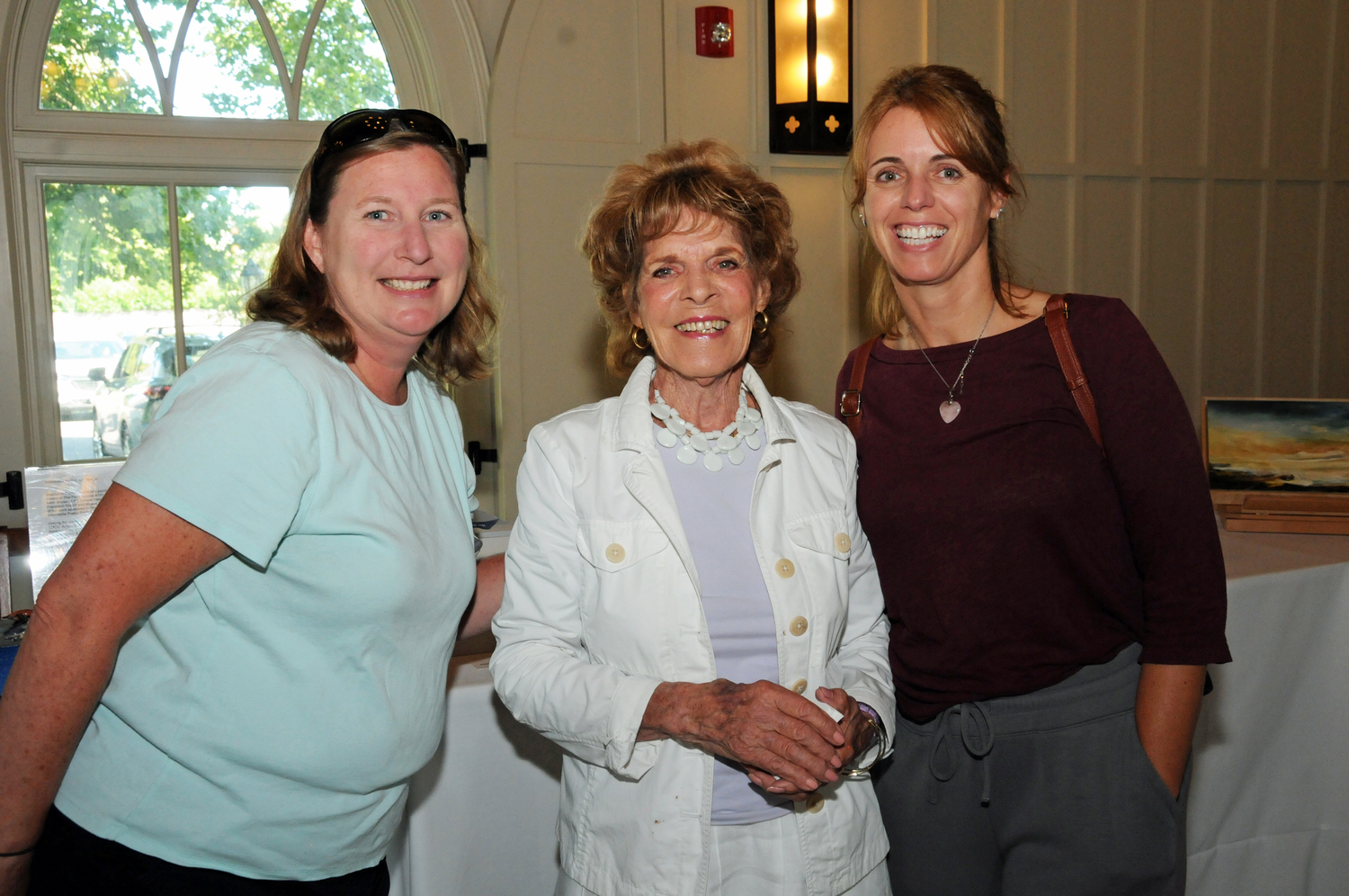 Rebecca Morgan Taylor, Arlene Bujese and Sonja Becker at the East End Hospice Box Art Auction preview benefit, featuring works by local artists, at St. Luke's Hoie Hall  in East Hampton on August 21.  RICHARD LEWIN