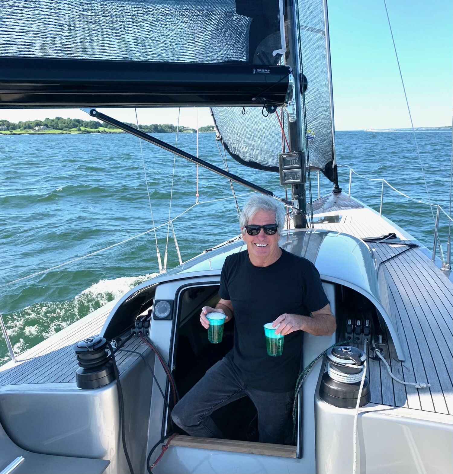 Bruce Tait at the helm of a sailboat. JOHN BAIER