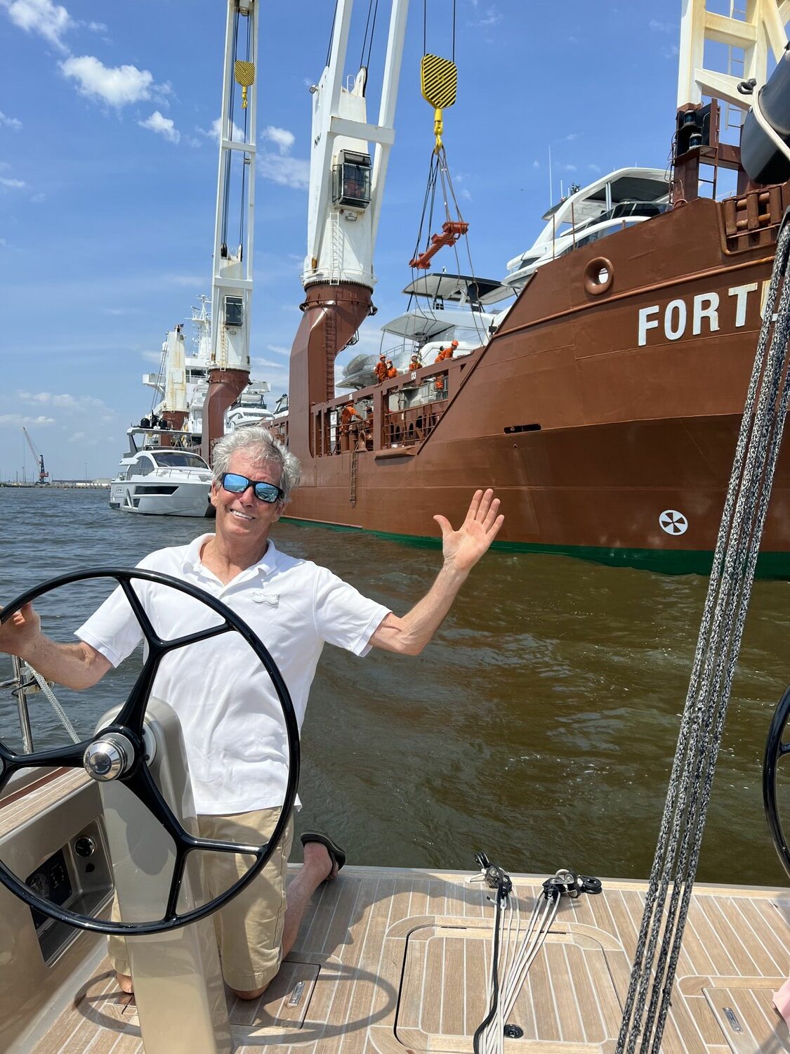 Bruce Tait at the helm of a sailboat. JOHN BAIER