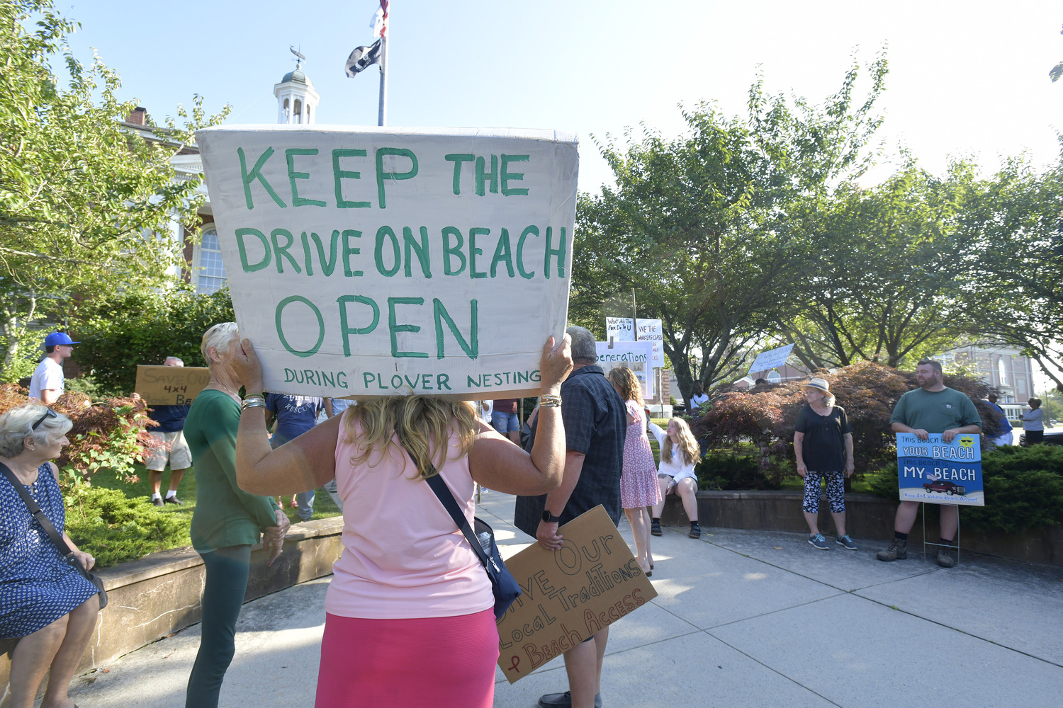 Frequenters of the Southampton Village beach known as the Picnic Area rallied outside Southampton Town Hall on Tuesday afternoon, then pleaded with the Southampton Town Board to find a way to amend the town’s piping plover protection program after the birds left their favorite summer haunt essentially off limits from early June through August 13.   DANA SHAW