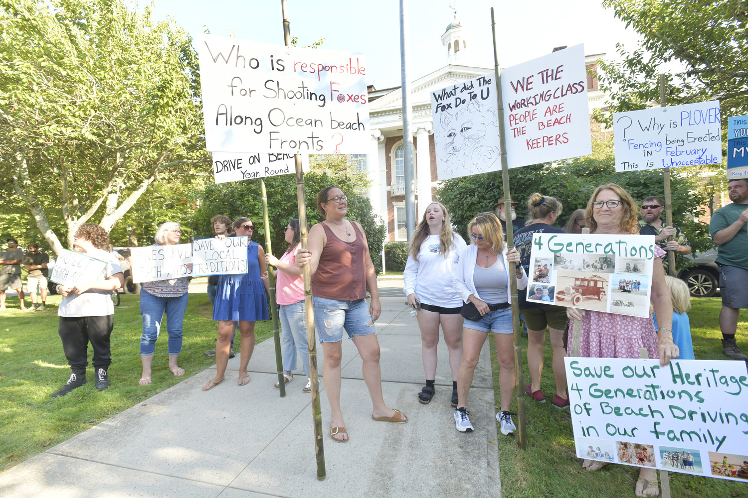 Frequenters of the Southampton Village beach known as the Picnic Area rallied outside Southampton Town Hall on Tuesday afternoon, then pleaded with the Southampton Town Board to find a way to amend the town’s piping plover protection program after the birds left their favorite summer haunt essentially off limits from early June through August 13.   DANA SHAW