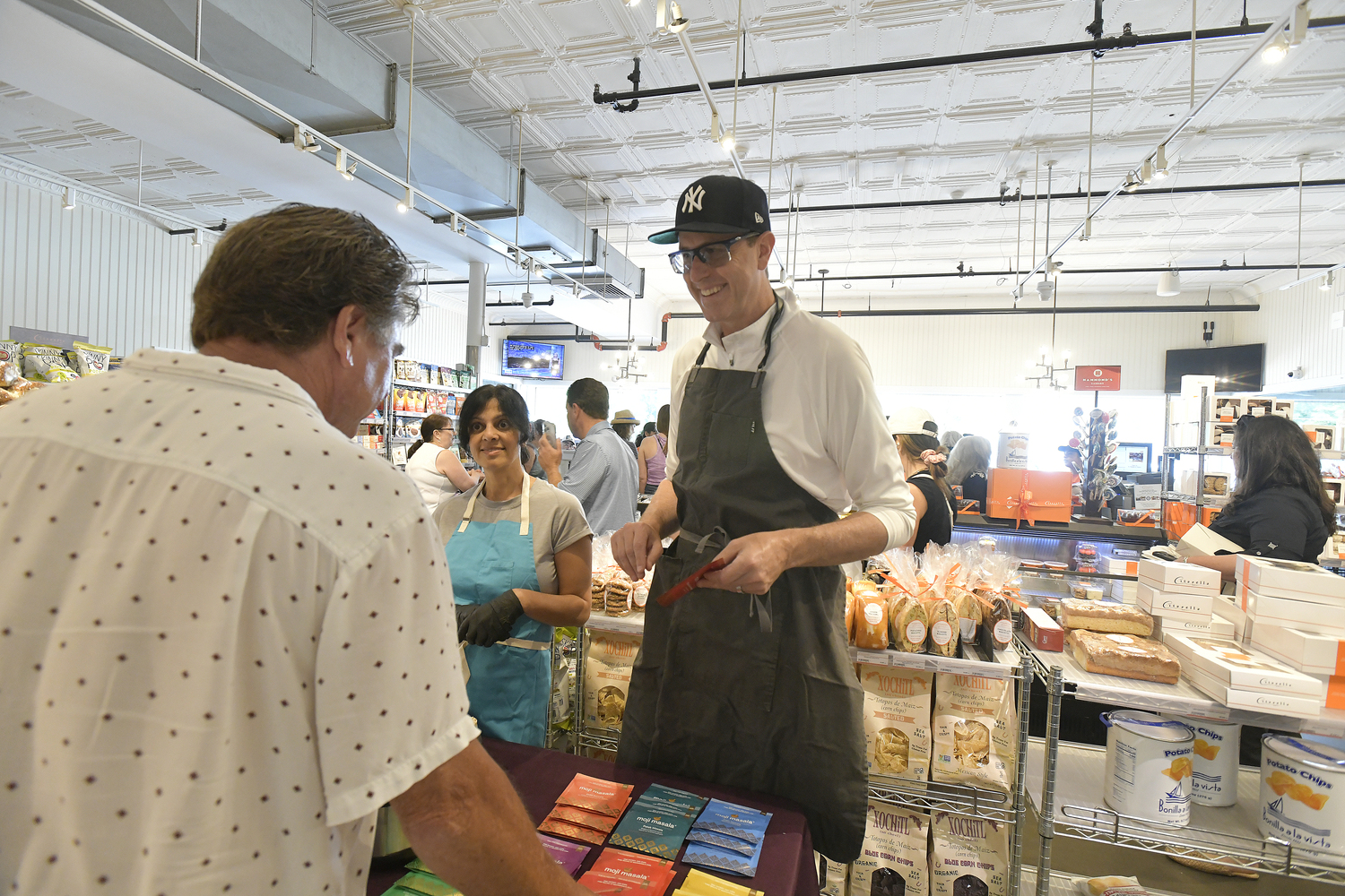 Shareen Qadri and J.D. Walsh creators of Moji Masala at a tasting at Citarella Gourmet Market in Southampton in July.  DANA SHAW