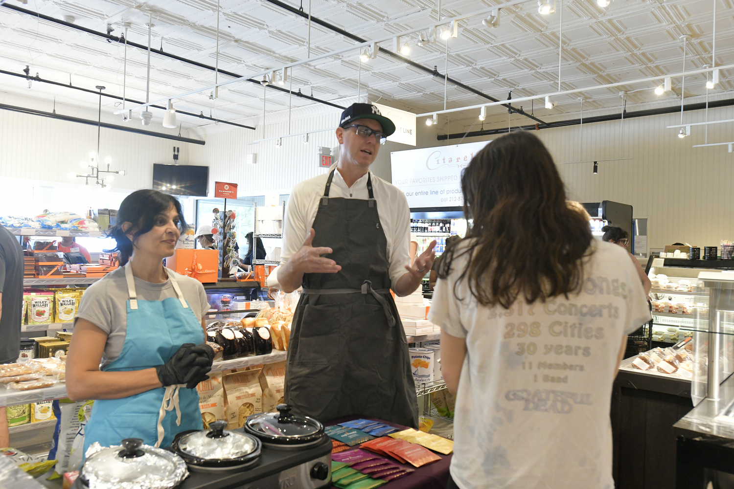 Shareen Qadri and J.D. Walsh creators of Moji Masala at a tasting at Citarella Gourmet Market in Southampton in July.  DANA SHAW