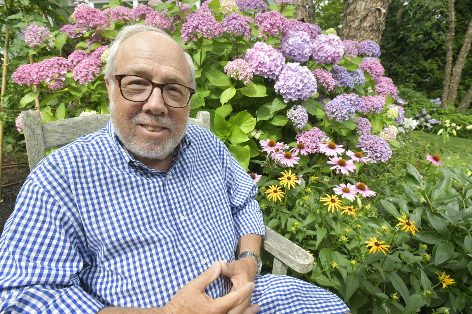 Ed Hollander in his Sag Harbor garden.  DANA SHAW