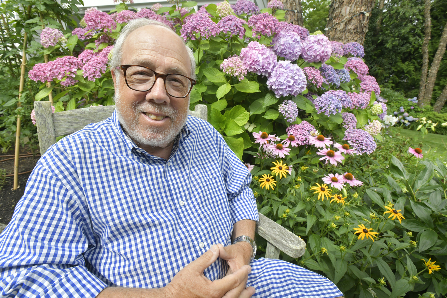 Ed Hollander in his Sag Harbor garden.  DANA SHAW