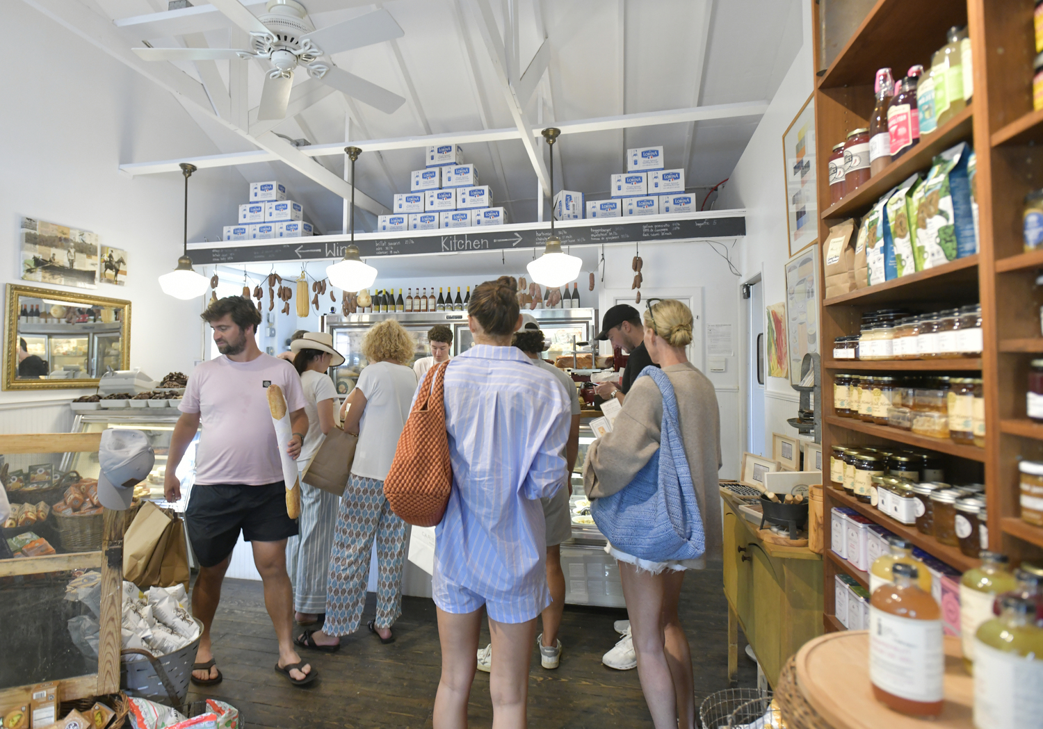 Patrons at Cavaniola’s Gourmet Cheese Shop in Sag Harbor.  DANA SHAW