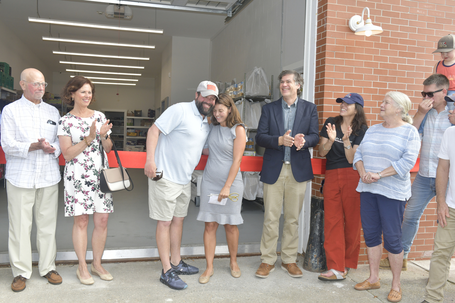 Former Heart of the Hampton Executive Director Hilton Crosby with current Executive Director Molly Bishop at the ribbon cutting for the headquarters on July 31.  DANA SHAW