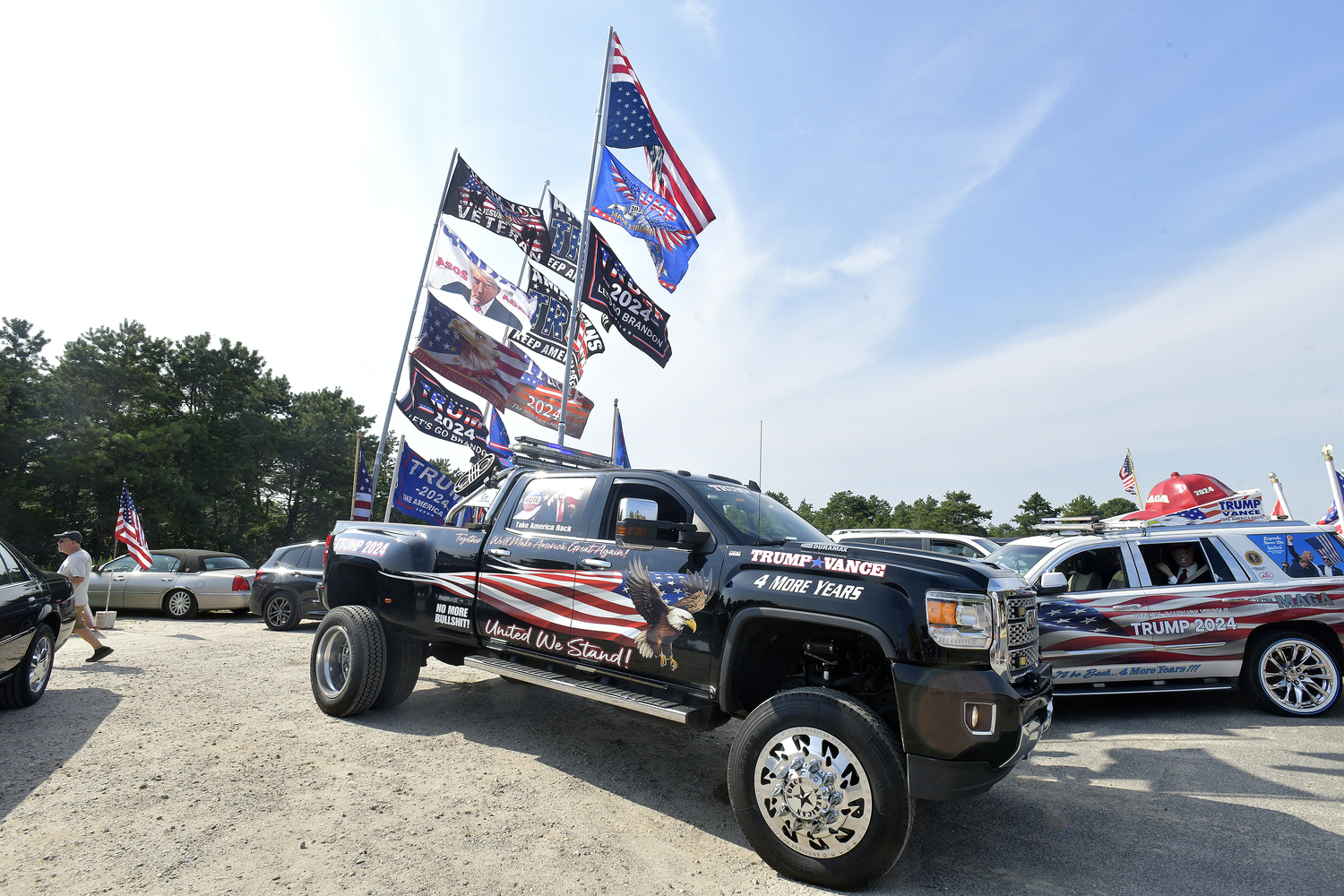 Supporters of former President Donald Trump lined a portion of Old Riverhead Road near Gabreski Airport in Westhampton Beach, waiting for hours to catch a glimpse of the passing motorcade. The former President's visit to the Bridgehampton home of Cantor Fitzgerald CEO Howard Lutnick for a campaign fundraiser. The visit brought traffic to a standstill across the east end for hours on Friday evening.  DANA SHAW