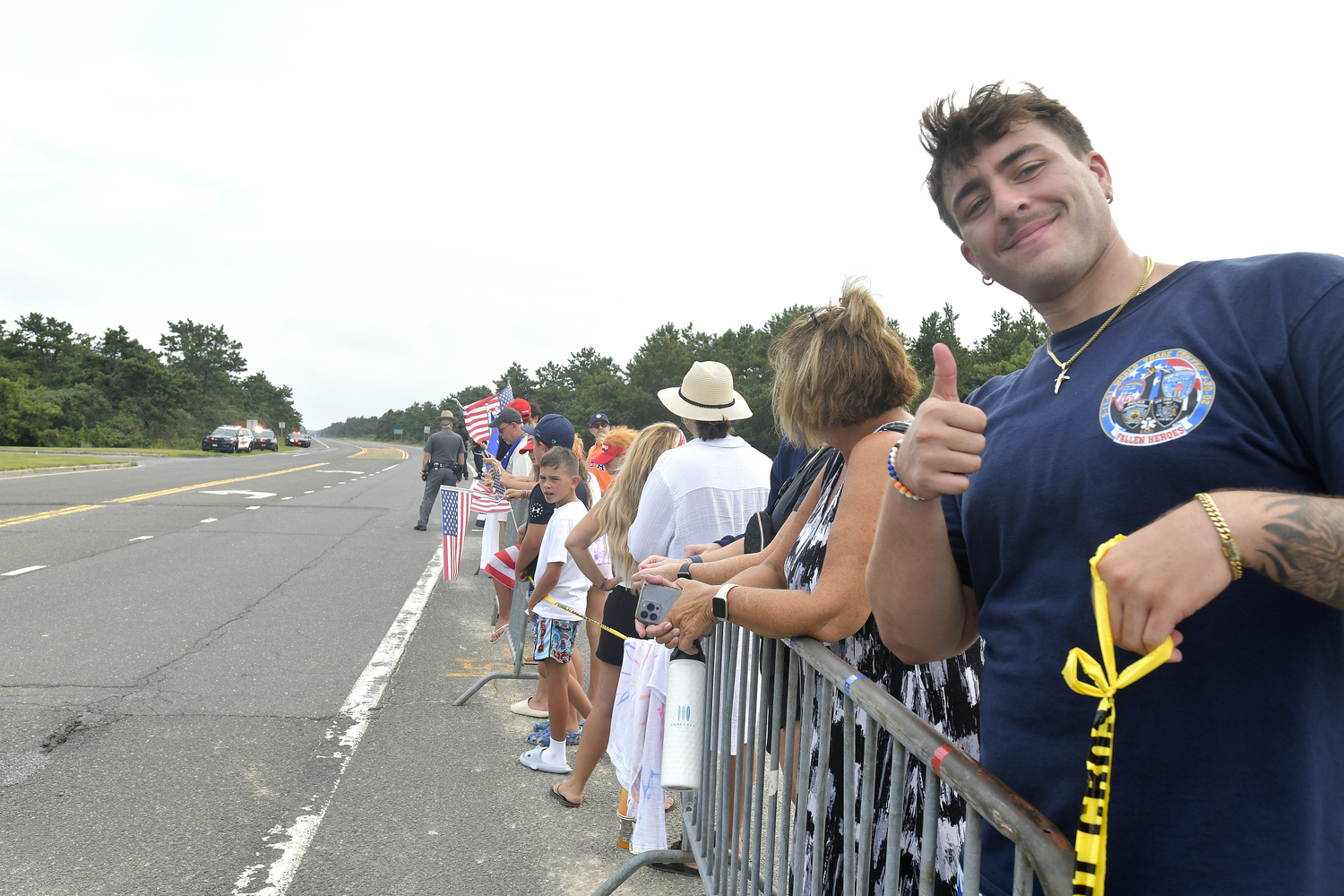 Supporters of former President Donald Trump lined a portion of Old Riverhead Road near Gabreski Airport in Westhampton Beach, waiting for hours to catch a glimpse of the passing motorcade. The former President's visit to the Bridgehampton home of Cantor Fitzgerald CEO Howard Lutnick for a campaign fundraiser. The visit brought traffic to a standstill across the east end for hours on Friday evening.  DANA SHAW