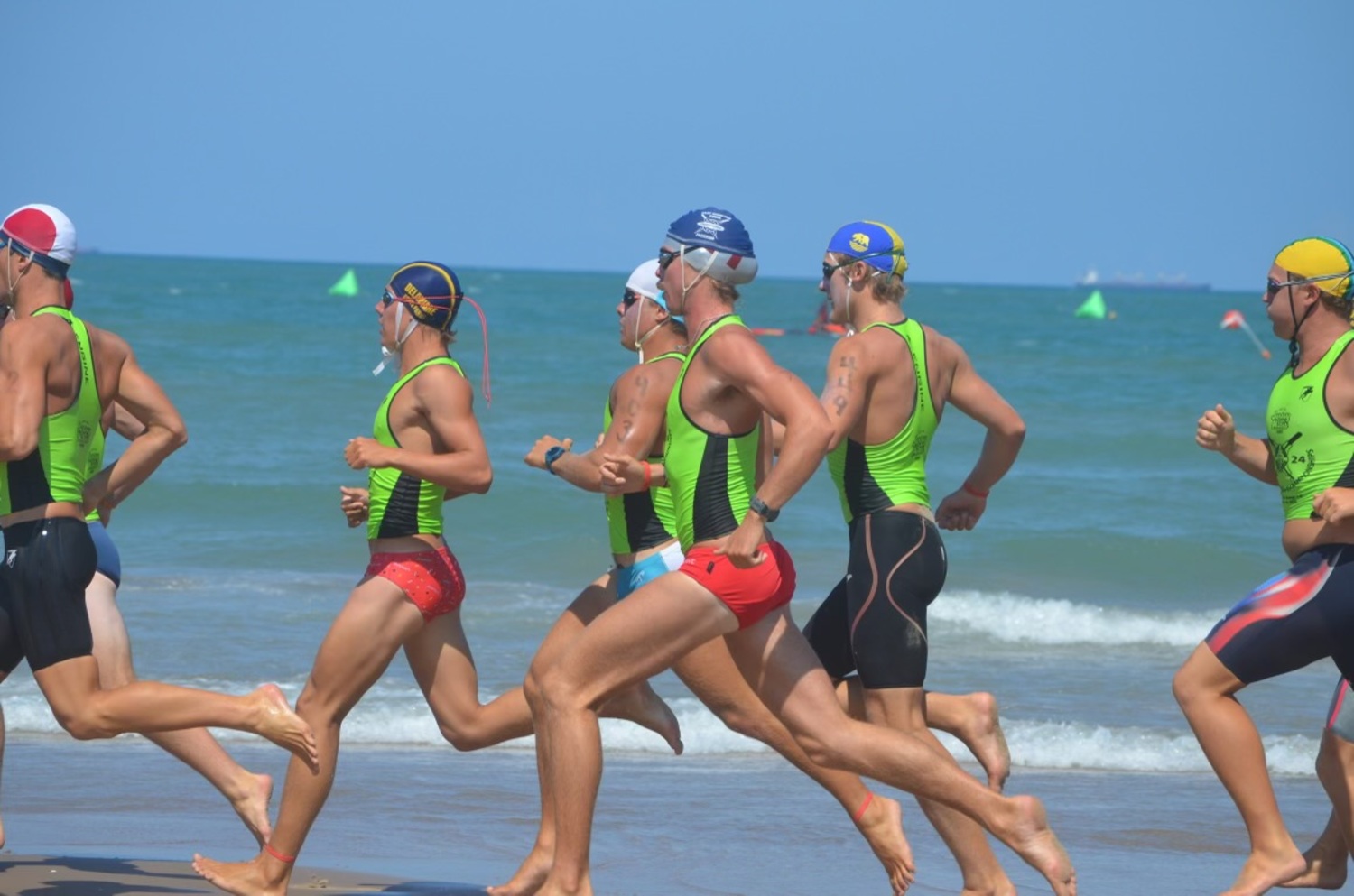 East Hampton Town lifeguard Thomas Brierley (blue cap) racing on the beach in Texas.