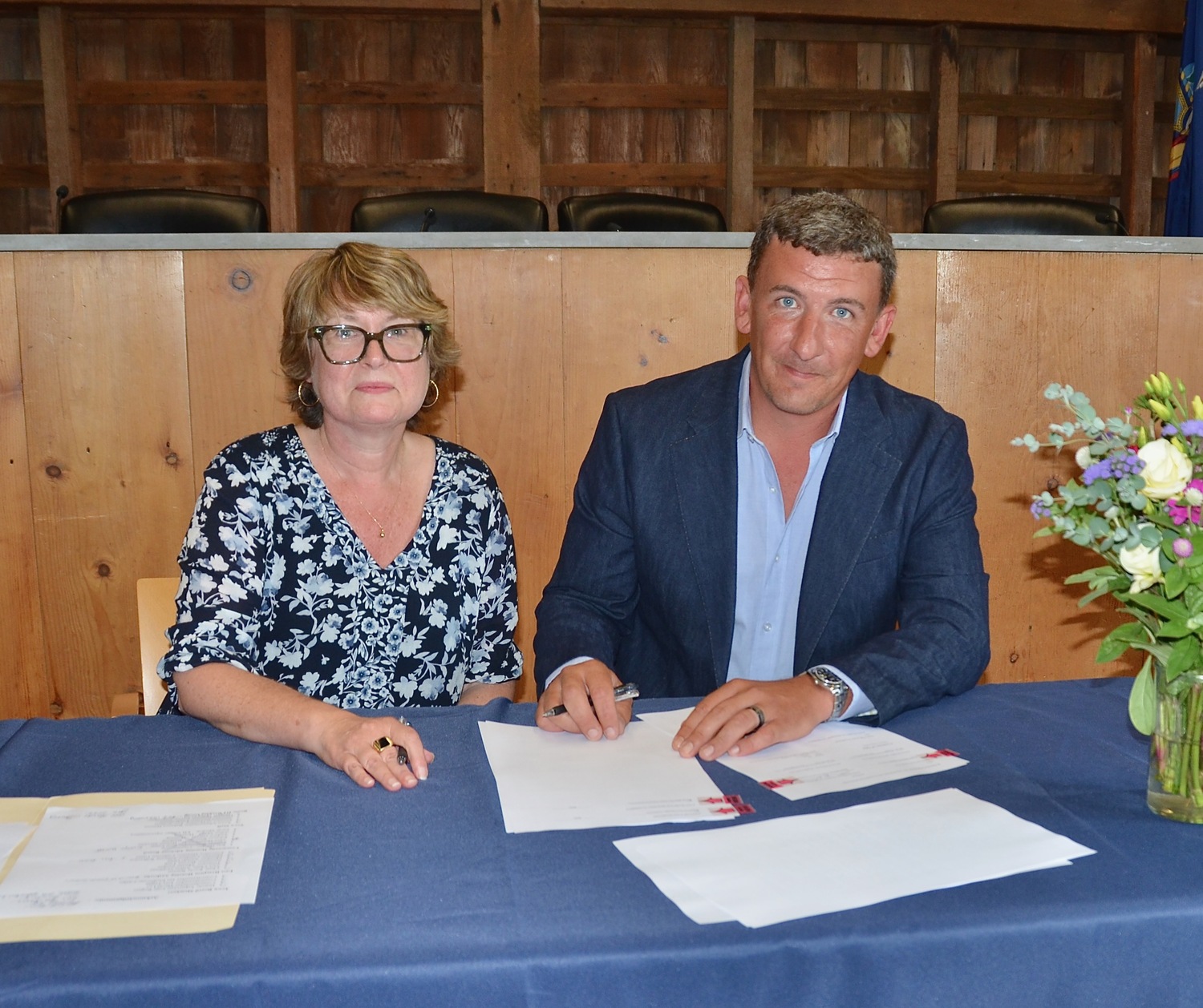 East Hampton Town Supervisor Kathee Burke-Gonzalez, with East Hampton Housing Authority Commission Chair Kevin Warren, signed a contract authorizing the transfer of two properties on Route 114 in Wainscott to the Housing Authority, on which affordable housing is to be constructed. KYRIL BROMLEY