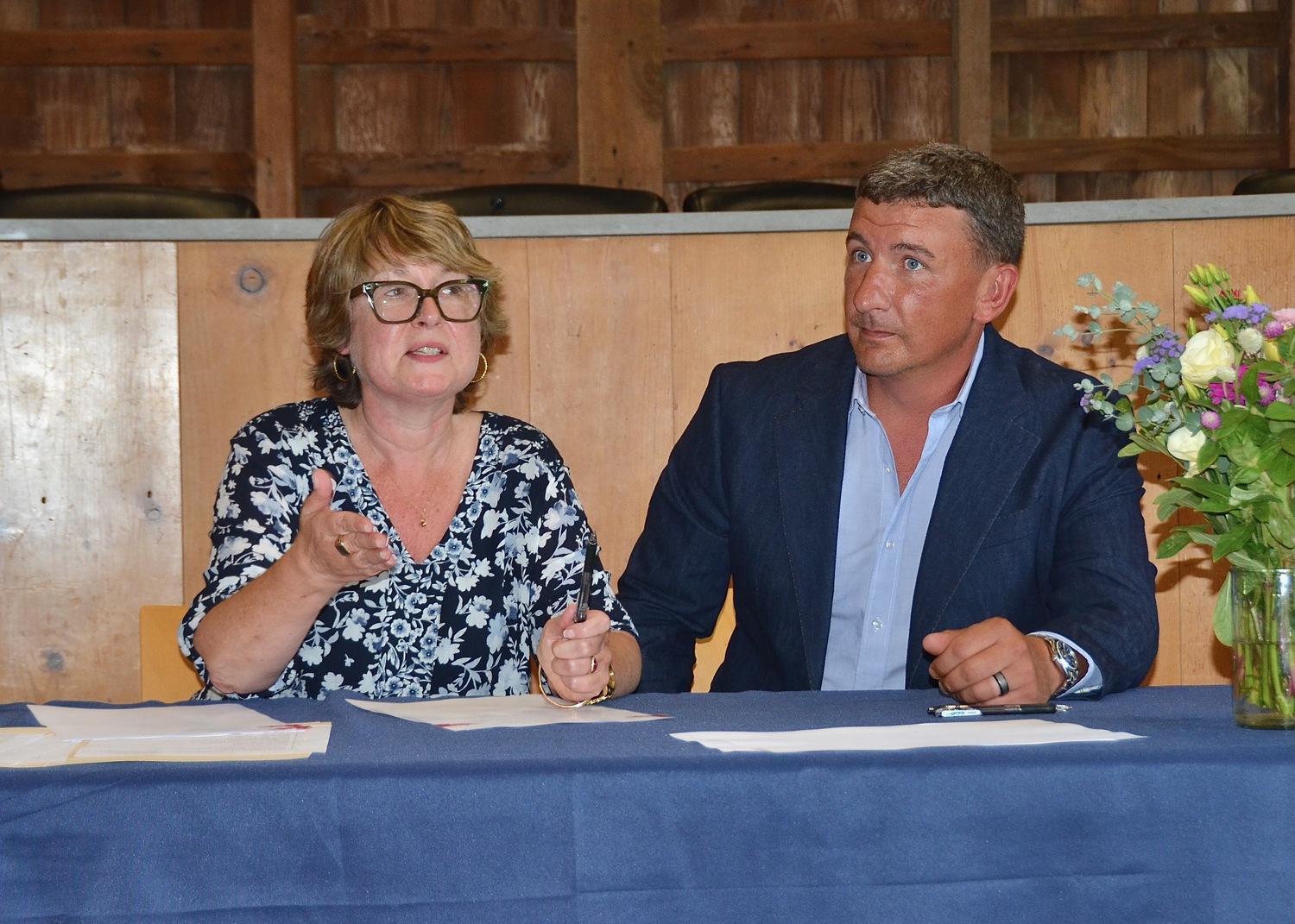 East Hampton Town Supervisor Kathee Burke-Gonzalez, with East Hampton Housing Authority Commission Chair Kevin Warren, signed a contract authorizing the transfer of two properties on Route 114 in Wainscott to the Housing Authority, on which affordable housing is to be constructed. KYRIL BROMLEY