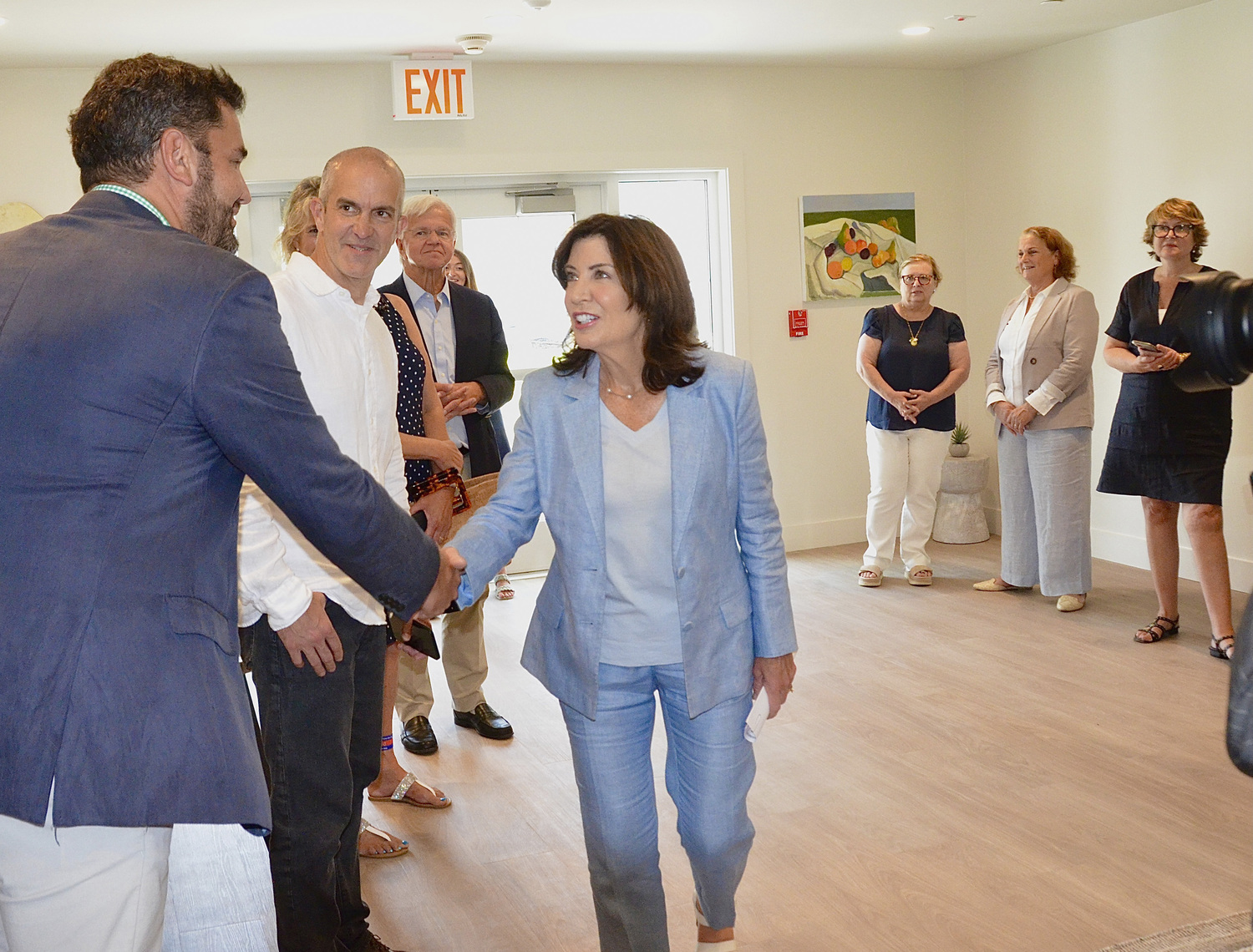 Governor Kathy Hochul greets East Hampton Town Councilman Tom Flight at the recently completed Green at Gardiner's Point affordable housing complex in East Hampton.   KYRIL BROMLEY