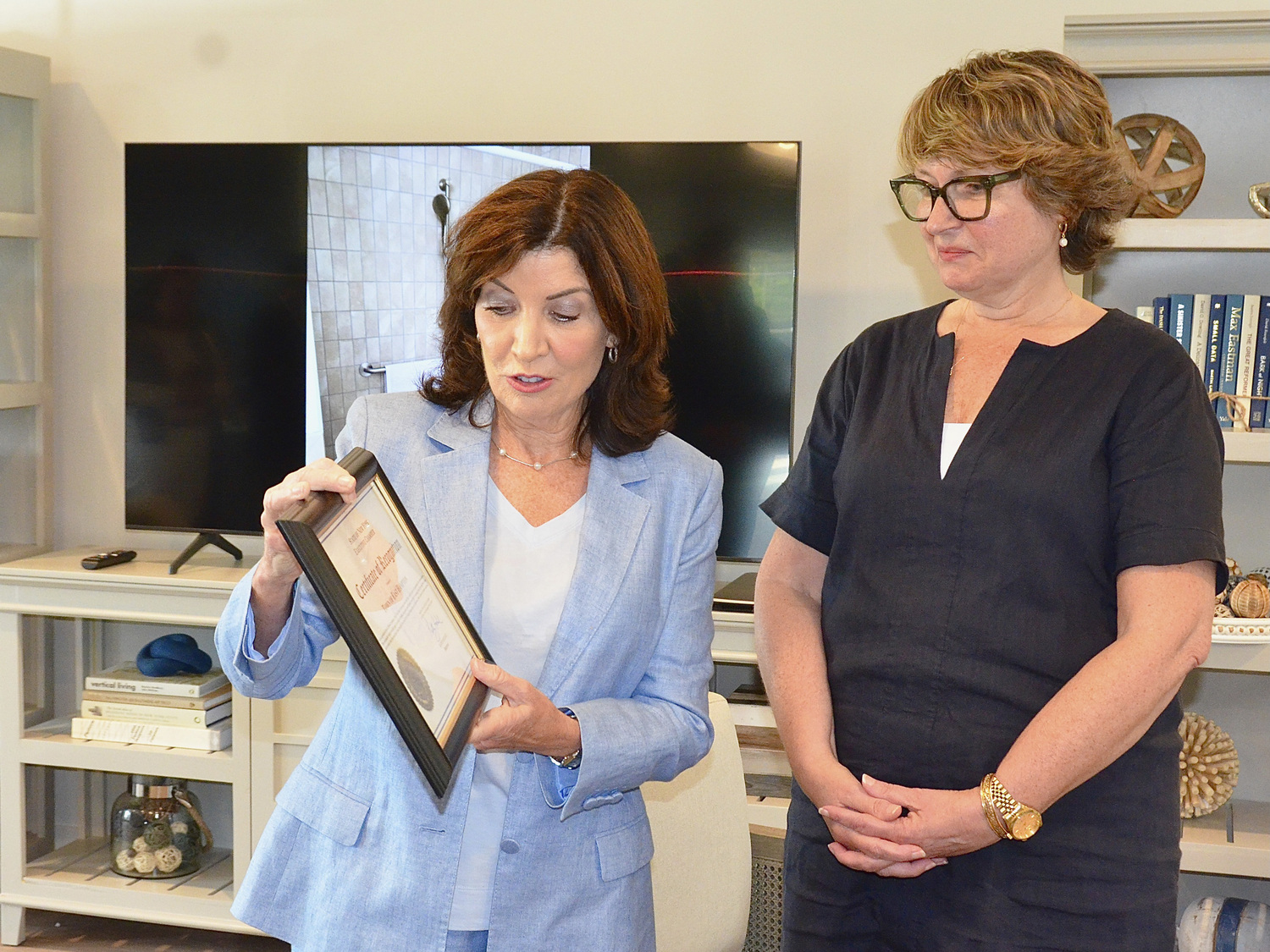 Governor Kathy Hochul presented East Hampton Town Supervisor Kathee Burke-Gonzalez with a certificate designating the town a Pro-Housing Community. KYRIL BROMLEY