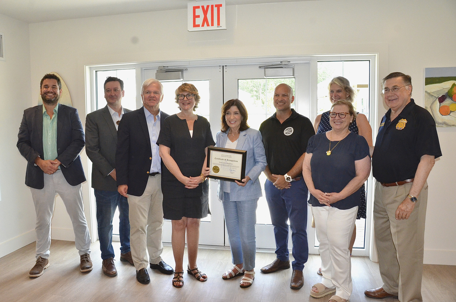 The East Hampton Town Board was joined by Assemblyman Fred W. Thiele Jr., Governor Kathy Hochul, Suffolk County Legislator Ann Welker and County Executive Ed Romaine at the Green at Gardiner's Point affordable housing complex in East Hampton on Friday.    KYRIL BROMLEY