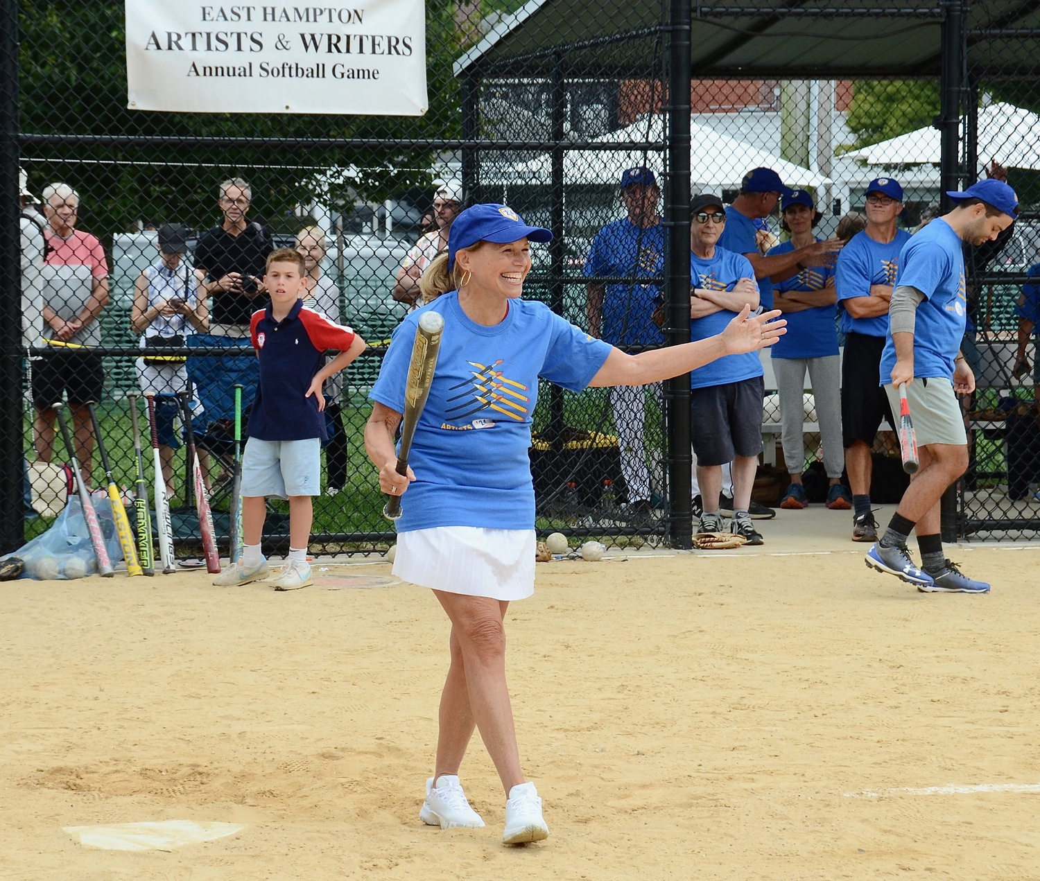 Katie Couric grabs a bat.   KYRIL BROMLEY