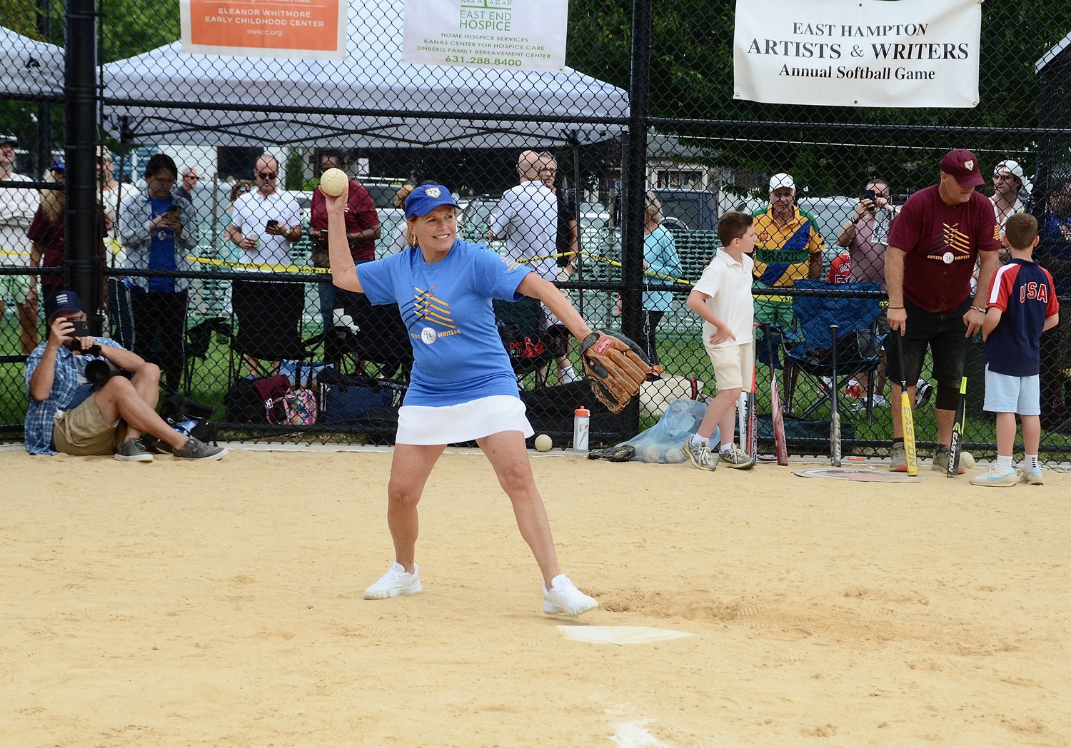 Katic Couric throws the ball back to pitcher John Franco.   KYRIL BROMLEY