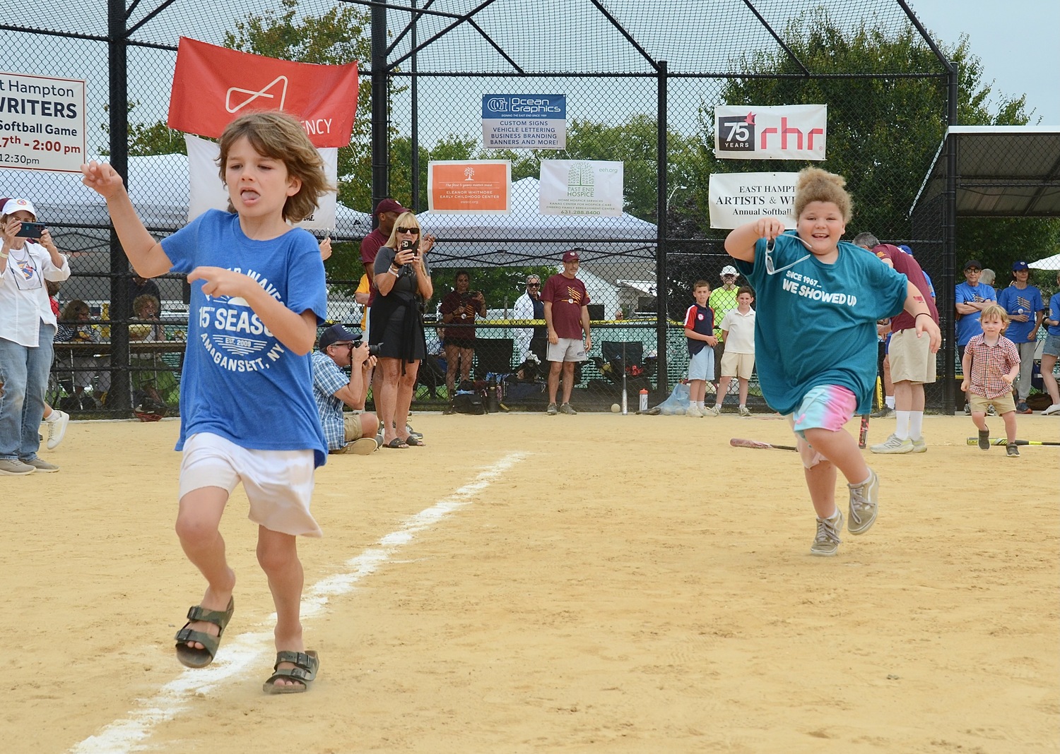 After spinning around a bat at home plate, kids run the bases.   KYRIL BROMELY