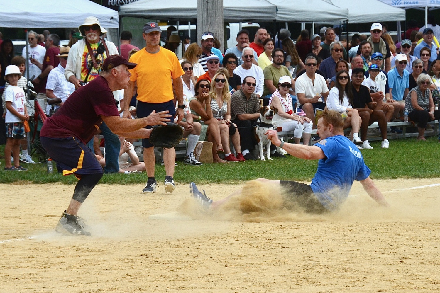 Jonathan Lemire slides into third base.  KYRIL BROMLEY