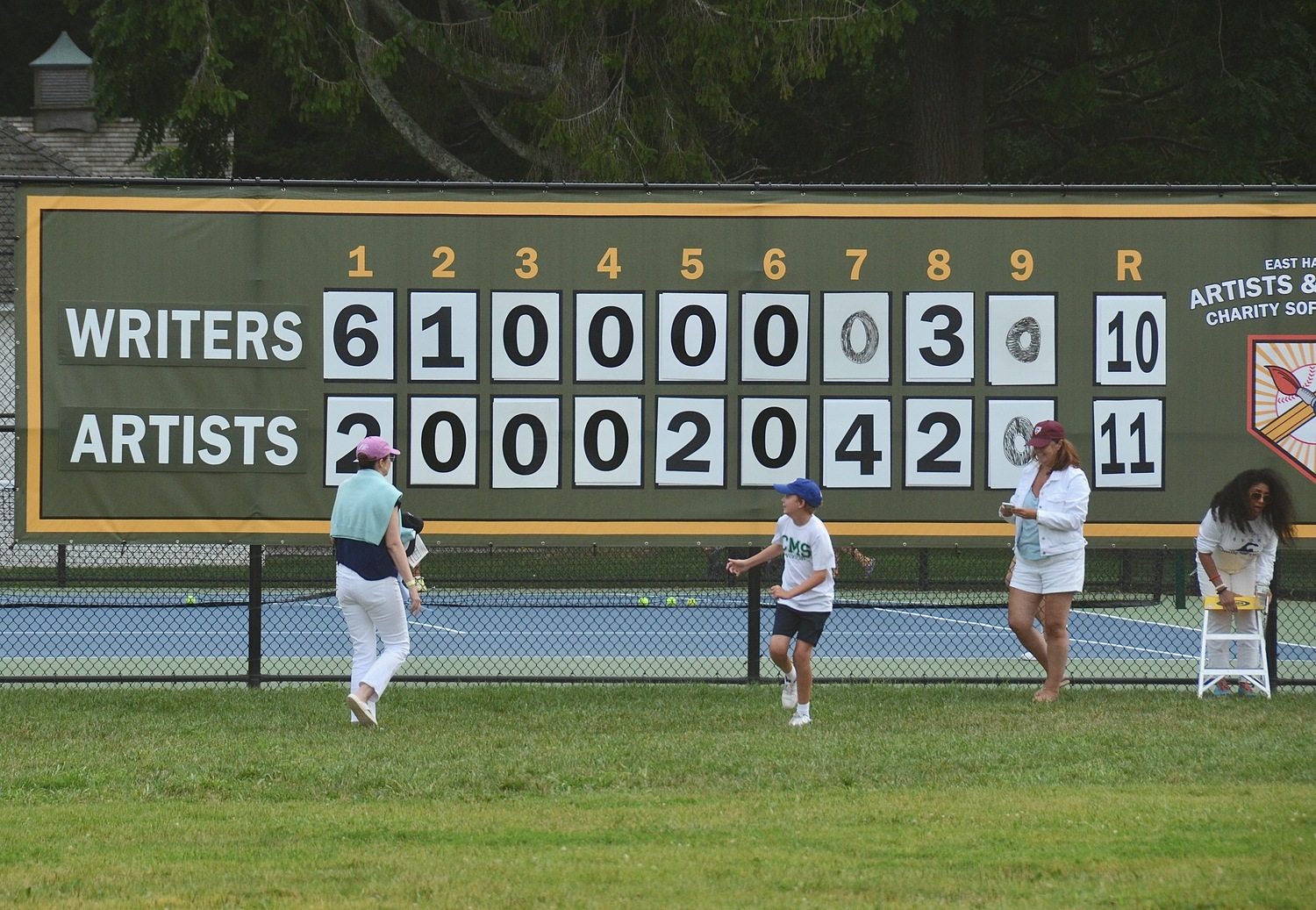 The brand new scoreboard shows the Artists defeating the Writers, 11-10, on Saturday.   KYRIL BROMLEY