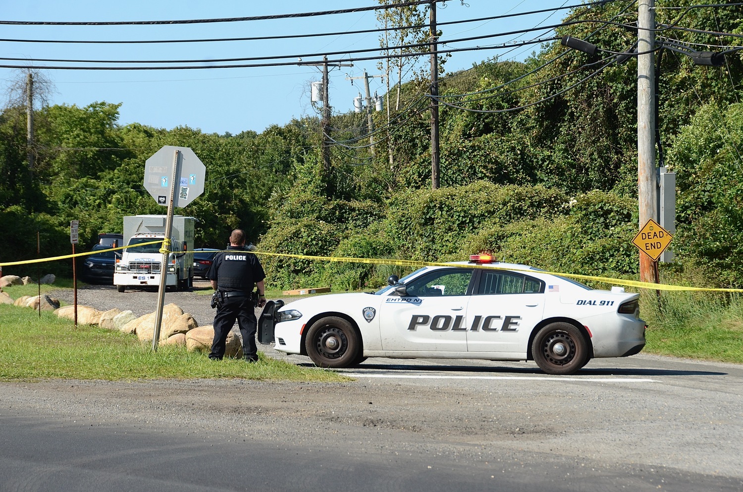 Police block the roadway earlier this afternoon during an incident on Edgemere Road in Montauk.     KYRIL BROMLEY