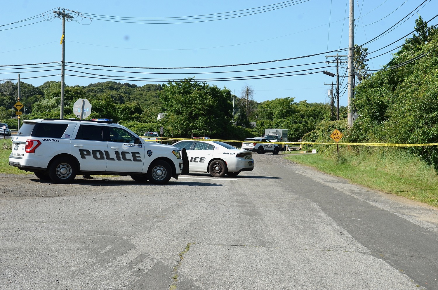 Police block the roadway earlier this afternoon during an incident on Edgemere Road in Montauk.     KYRIL BROMLEY