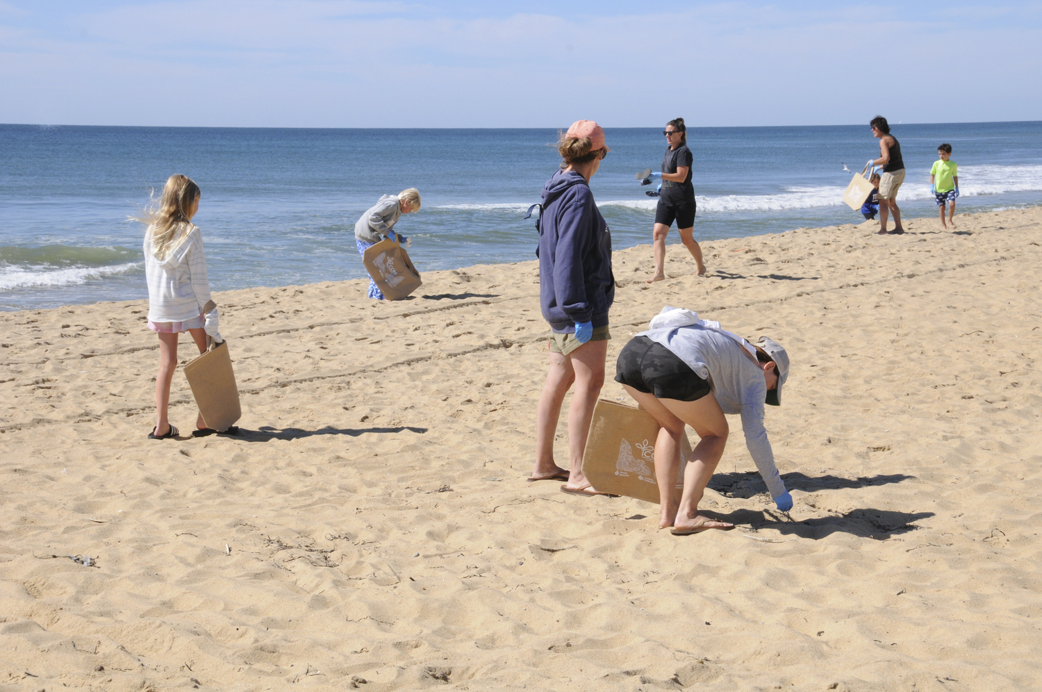 On August 15, The Concerned Citizens of Montauk showed their concern for ecology with a combined outdoor and indoor event...a kids beach cleanup and an art project. The first task was to gather discarded plastic litter items from the ocean beach behind the CCOM office into a custom CCOM canvas bag, followed by a creative art project at a communal table in the office, where the items were reused to make imaginative jars for the participants to take home.    RICHARD LEWIN