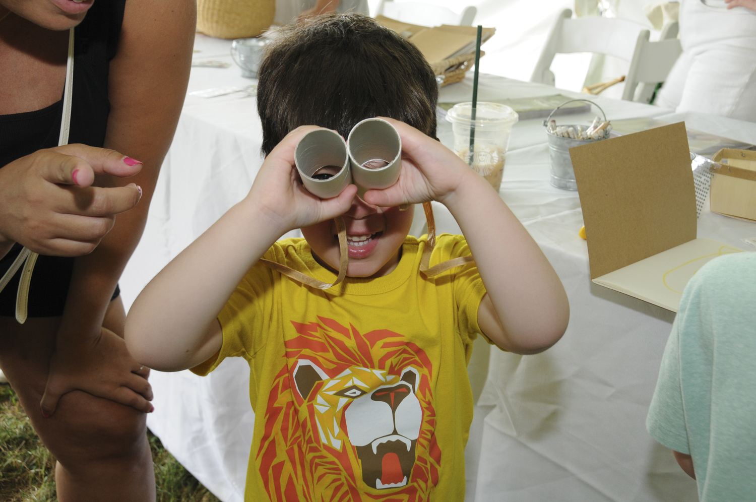 The East Hampton Library hosted its annual Children's Fair in Herrick Park on Sunday The weather was perfect for a huge assortment of amusement park rides, a crazy magic show, arts and crafts and carnival games. Families had the opportunity to meet authors of their favorite books in person. The line at the free ice cream truck was endless.   RICHARD LEWIN