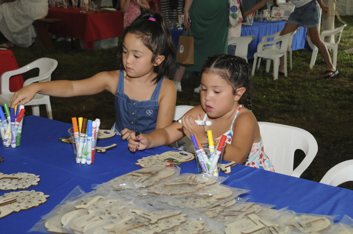 The East Hampton Library hosted its annual Children's Fair in Herrick Park on Sunday The weather was perfect for a huge assortment of amusement park rides, a crazy magic show, arts and crafts and carnival games. Families had the opportunity to meet authors of their favorite books in person. The line at the free ice cream truck was endless.   RICHARD LEWIN