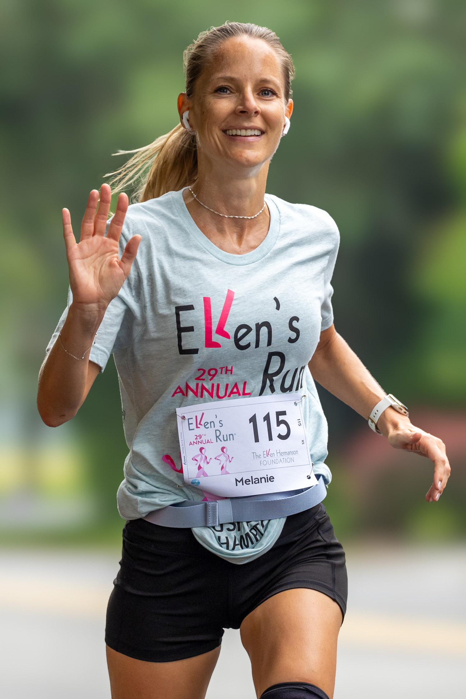 Melanie Von Schimmelmann gives a wave as she finishes up Sunday morning's race.   RON ESPOSITO