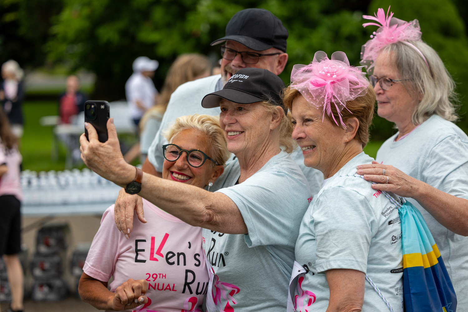 Breast cancer survivors and race participants take a photo together.   RON ESPOSITO