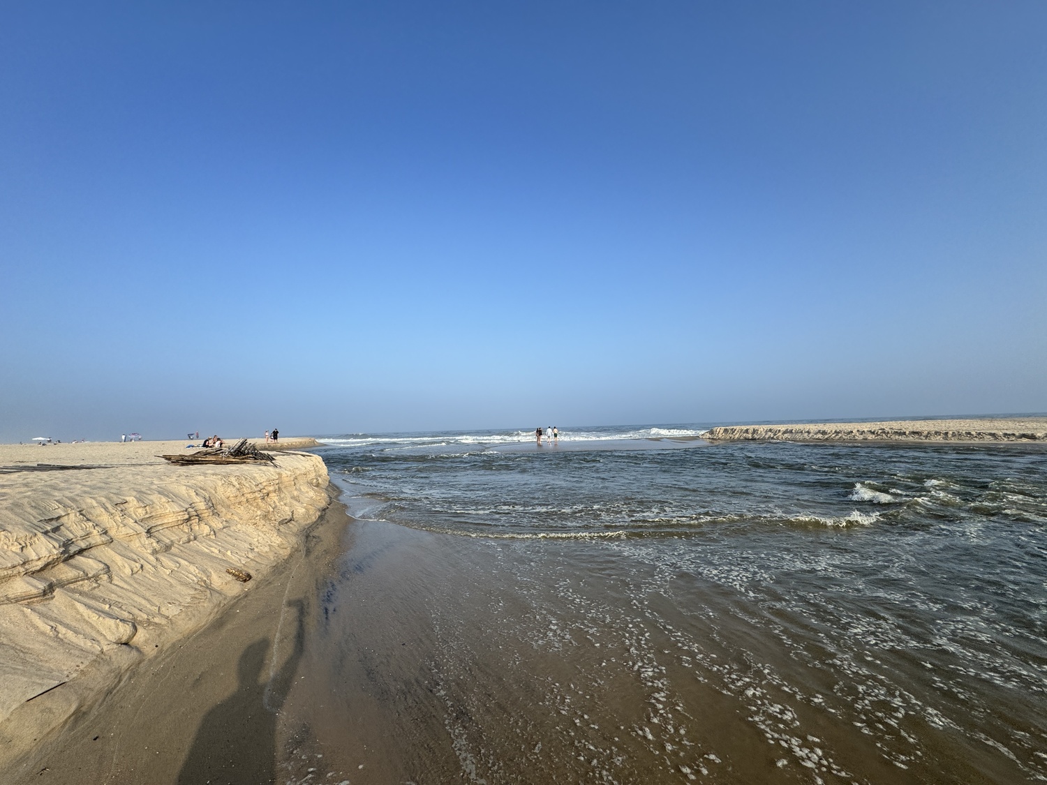 The small trench dug by someone though just a few feet of sand between Sagg Pond and the ocean on Wednesday quickly widened to more than 50 feet wide as the brimming pond flushed out to the ocean. MICHAEL WRIGHT