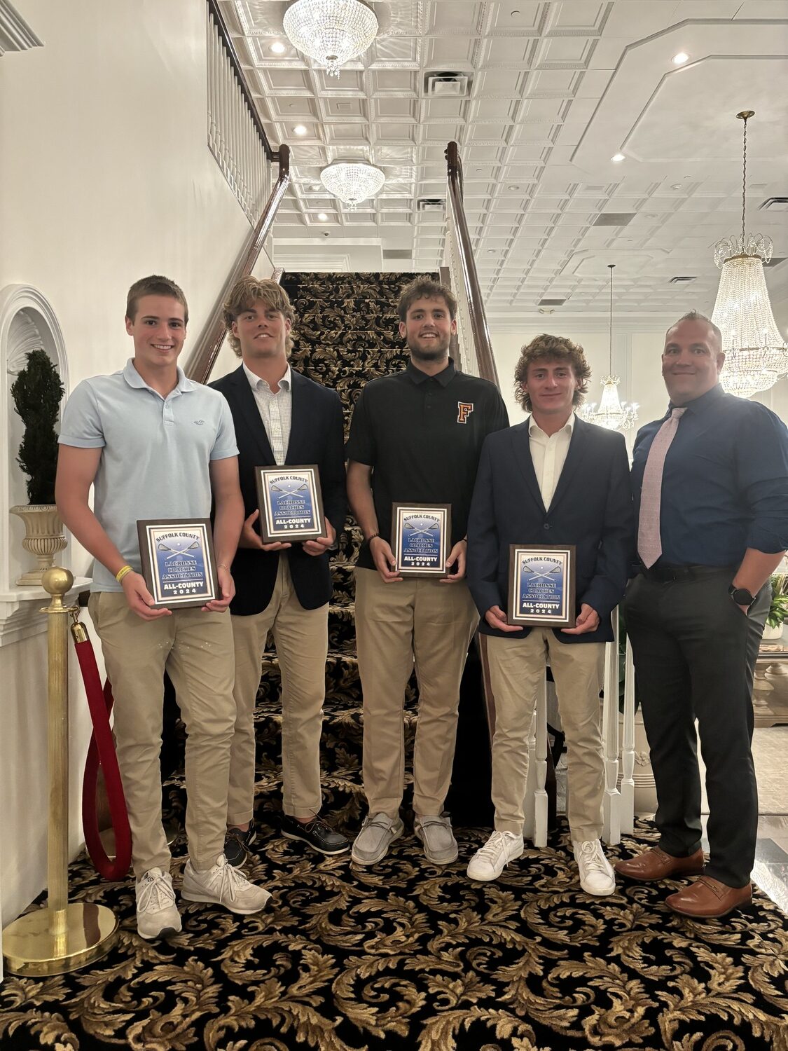 South Fork boys lacrosse players Luca Lattanzio, left, Charlie Corwin, Isaiah Lattanzio, Luke Castillo and head coach Matthew Babb.   NICOLE CASTILLO